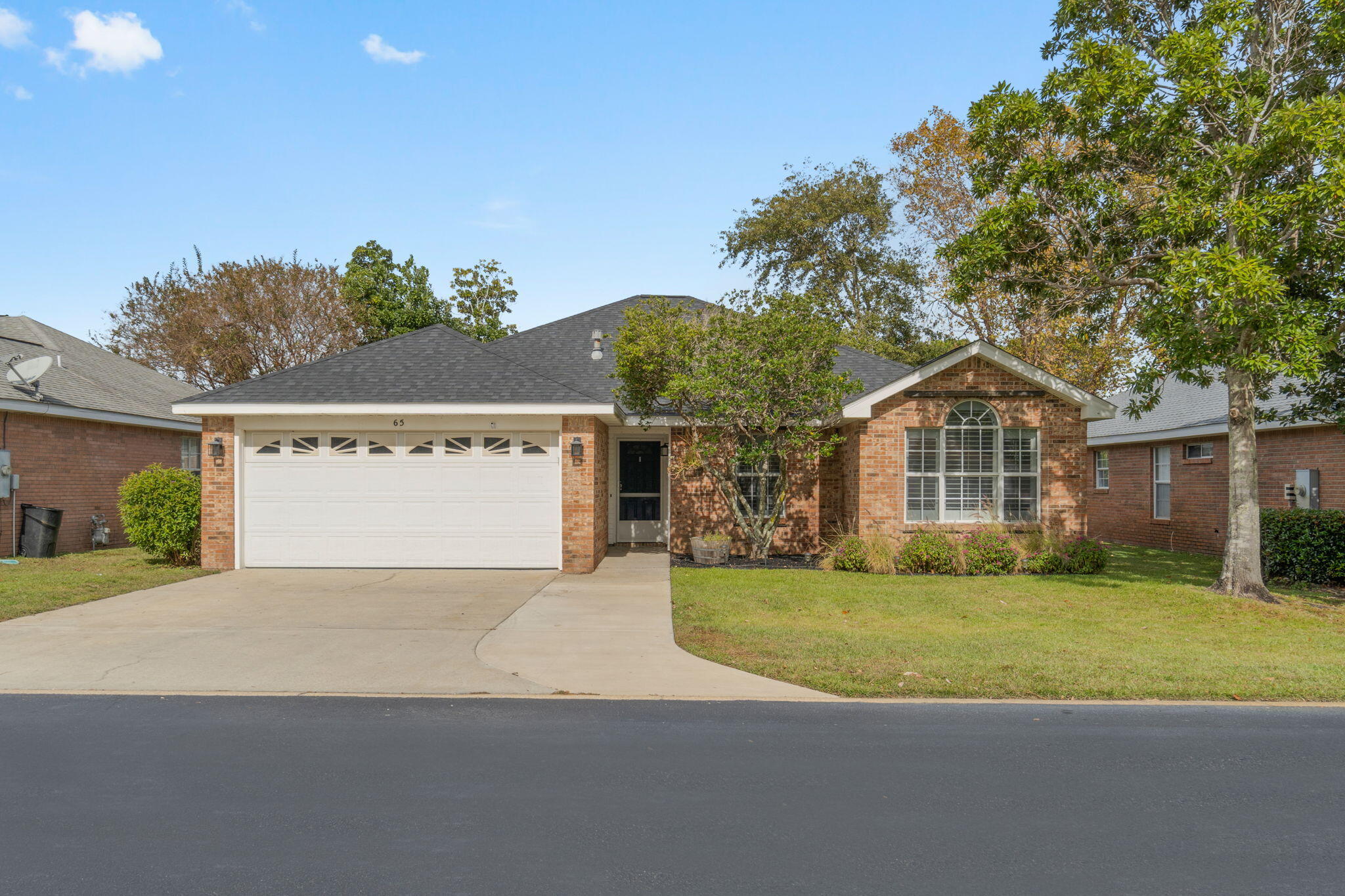 *Pet Friendly, updated, and available 12/1* Welcome to the adorable and perfectly located neighborhood of Bayside! Positioned walking distance and tucked behind 98 beside the Silver Sands Outlet mall you will love being in the heart of Miramar Beach close to shopping, dining, and gorgeous beaches. Additionally, enjoy neighborhood amenities such as a pool, pavilion and grilling area, playground, tennis/pickleball court, and bay access with a fishing dock right on the water! This thoroughly updated home features a split floor plan with 3 bedrooms, 2 baths, an enclosed heated and cooled Florida room, and a 2 car garage (with epoxied floor) within a fully fenced in backyard. NO bedroom carpet! Tile and luxury vinyl floors are throughout. Each closet has a custom closet organizer. Quartz counters in both bathrooms adorned with updated lighting and lovely shiplap above updated cabinetry. The kitchen is well appointed with stainless appliances including an updated french door refrigerator with custom features. You'll love the tasteful sea glass subway tiles accenting the gorgeous quartz counters, soft close custom cabinets, and the kitchen island was custom made for this space with room for bar stools, and pull outs to maximum storage in addition to the custom pantry and spice rack/pan storage on either side of the oven. The interior Florida room is a great space to relax with the lovely brick flooring. Love other upgrades like plantation shutters, ceiling fans throughout, recessed lighting, and custom fireplace with a wood mantle. The yard was renovated with all new landscaping and there is a sprinkler system (on a well so you're not paying for water!). Trash and pest control is included in the rent as well as all neighborhood amenities. Pets are allowed with a $300 non refundable pet fee per pet, 2 pets maximum, no aggressive breeds. Security deposit is equal to one month's rent. 1 year lease preferred, shorter lease term (over 6 months) will be considered. Link to apply: https://www.apartments.com/apply-online/?token=l3j1tce&l=3m0n6zf&u=yq7vvhr&landlordInvite=true