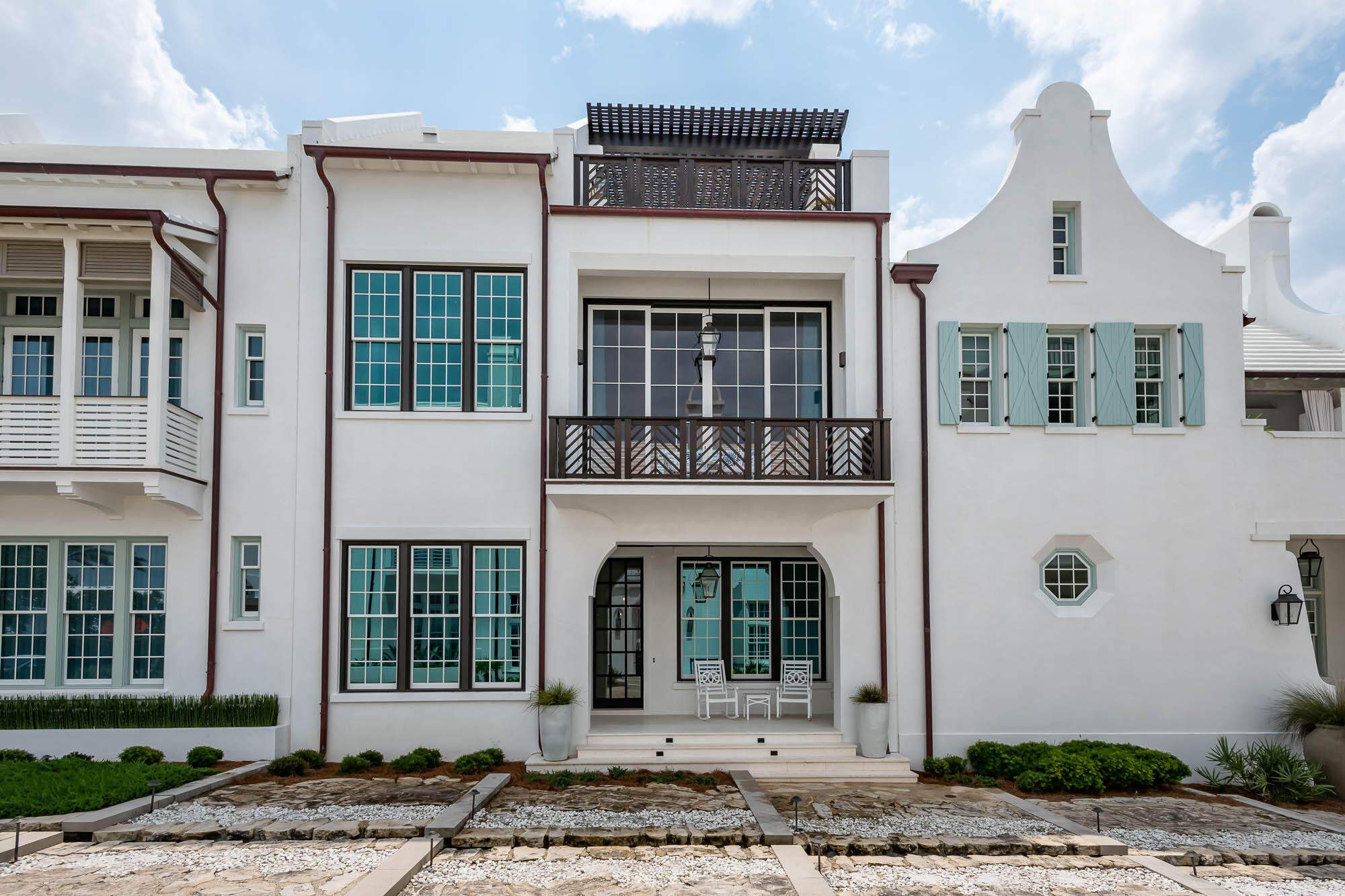 Built by Galvas Construction and designed by Domin Bock Architects, this home was completed in July 2021.  Perfectly located on the coveted south side of 30A, the home fronts on Sea Garden Path with a unique water feature runnel at the front door, steps from the Beach Club. The home has four spacious bedrooms with baths, and a downstairs den that has a queen-sized sofa bed to give a fifth sleeping space.  The first floor features a den that opens to a heated pool and outdoor gas grill.  A convenient, enclosed outdoor shower is located just outside the pool area. A full-sized laundry room and downstairs half bath are tucked just inside the back door.  A large bedroom downstairs along with a room outfitted for the kids with a bunk and trundle bed. The second floor showcases dramatic 14-foot ceilings in the great room/kitchen/dining area with stunning Venetian plaster walls and tall windows for light. Gorgeous kitchen with lots of storage, two dishwashers, extra sink with filtered water, and an extra ice maker make this the perfect entertaining space. Windows have electronic shades that are programmed into the Control4 system (as is the TV/sound system and HVAC.) Large main suite boasts a large closet and sitting area.  A second washer and dryer are located adjacent to the suite. Third floor den offers another media space and opens to a terrace with views of the Gulf.  The third-floor patio features a gas fire pit and trellised seating area to enjoy sunsets. Burglar and fire alarm system monitored by Coastal Protection.  AV provided by Innovative Solutions.  All systems can be controlled from anywhere with Control4 system.