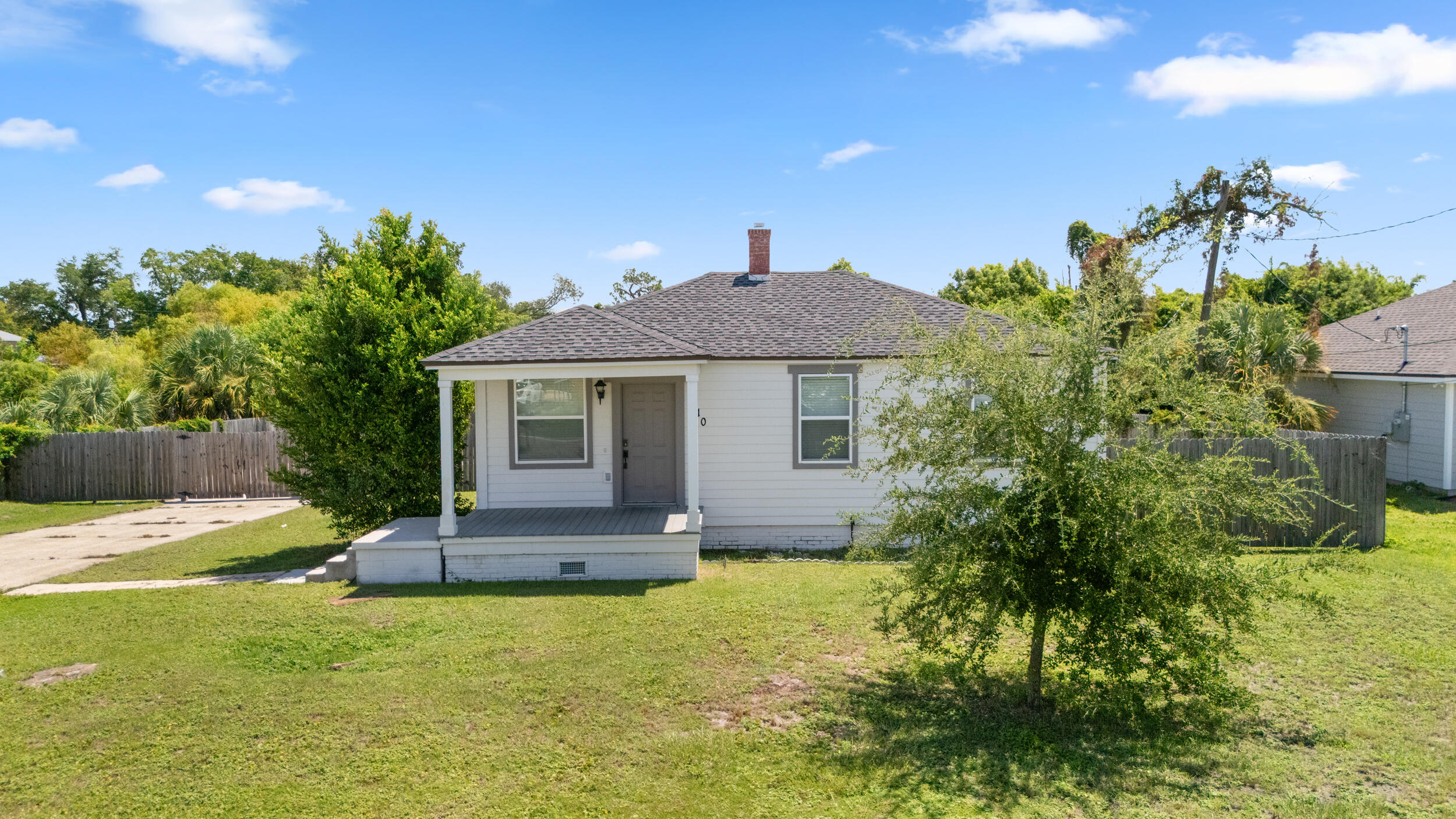 Experience modern comfort and style in this fully renovated home, updated home in the historic Cove neighborhood. The interior showcases durable LVP flooring, elegant quartz countertops, and beautifully tiled showers. The primary ensuite offers a spacious retreat with high-end finishes and thoughtful design. A brand new deck overlooks a huge, private fenced-in back yard on 1/3 acre. Lovingly restored in 2018 following Hurricane Michael, this home has brand new LVP floors, modern kitchen with new appliances, quartz counters, two full baths and three roomy bedrooms. Located less than a mile from historic downtown Panama City and two blocks from St.Andrews' Bay, this is a prime location tor families and professionals who want to experience the full coastal lifestyle living in the Cove. Convenient to schools, churches, retail and located less than a mile from the reinvigorated vibrant downtown Panama City. This home blends quality craftsmanship with contemporary design, offering a move-in-ready living experience. This home was fully remodeled in 2018 and has been a long-term rental property since that time. Ideal as a primary home, long or short-term rental. Buyer to verify all dimensions. Monthly rent include: electricity, water/sewer/trash, pest control and lawn care. Tenant is responsible for Internet and streaming services. Home is unfurnished. Background and credit check are required. Deposits include first/last month's rent. Will consider pets on a case-by-case basis with a non-refundable pet damage deposit.