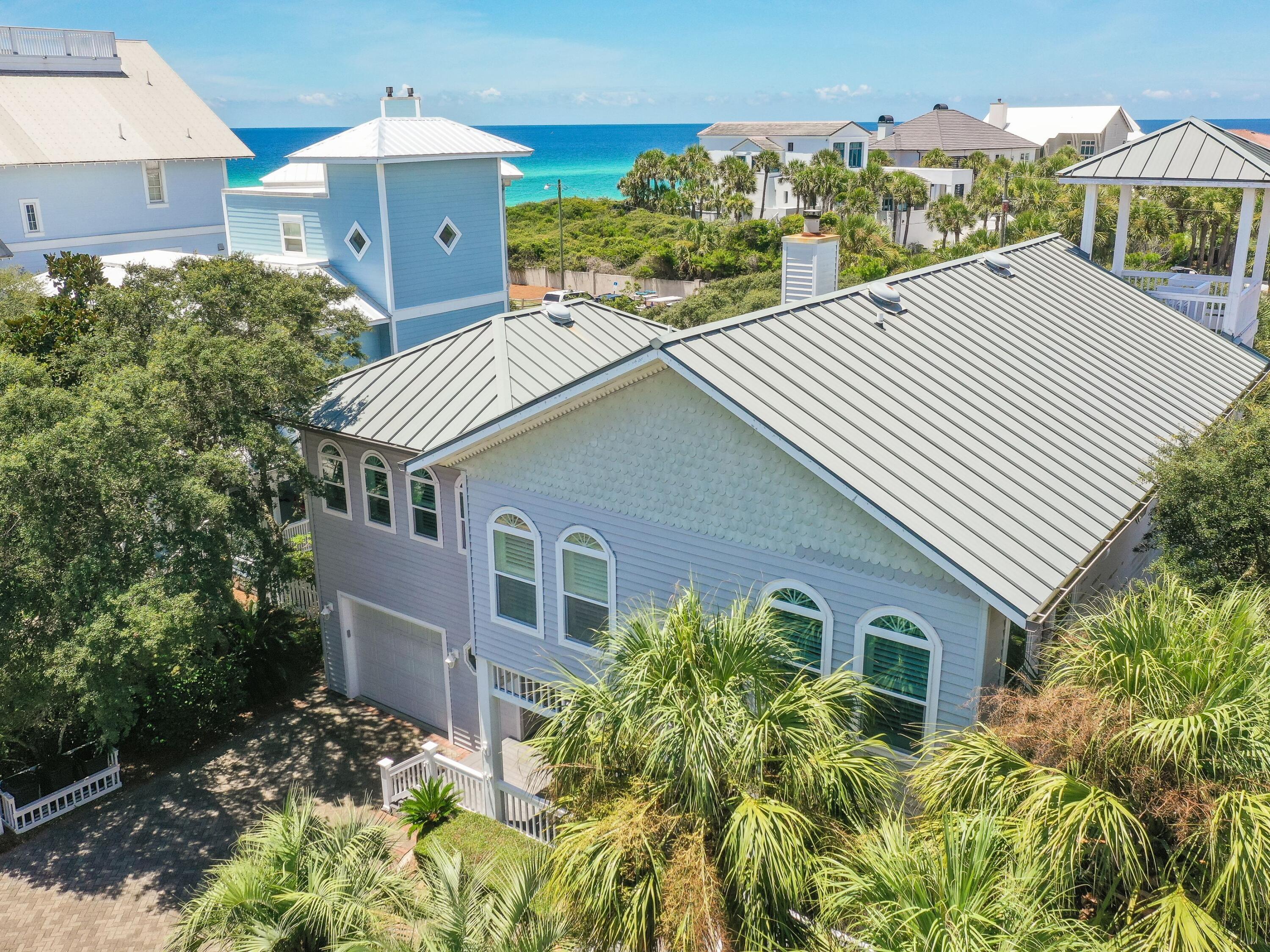 UNDER CONTRACT, ACCEPTING BACK UP OFFERS DURING CONTINGENCY PERIOD.  Get ready to enjoy unobstructed Gulf of Mexico views from your master bedroom suite!  This property enjoys forever gulf views from the second and third floors of the main house and the carriage house. The large detached garage has a self-contained one-bedroom apartment with a full kitchen on the second floor.  Located in the sought-after, private beachfront, gated community of Old Florida Beach, this beach house is just three homes from the beach and has huge potential to update and make it your own.   The main house has three generously sized bedrooms, each with its own bathroom. The living area opens into a large kitchen/dining area.  The home is well built with 9 feet ceilings throughout. The 3rd floor lookout tower has breathtaking gulf views, best enjoyed with a long cool drink as the sun goes down. The private landscaped backyard has mature trees providing dappled shade for barbecues or relaxing after a day at the beach. This enviably located beach house is an investment opportunity for the new owners to update and create immediate equity. Old Florida Beach community is located south of 30A directly on a private beach, has heated community pool, Draper lake dock, and 3 private beach accesses.  The established neighborhood makes it ideal for full-time residents or as a vacation rental.
