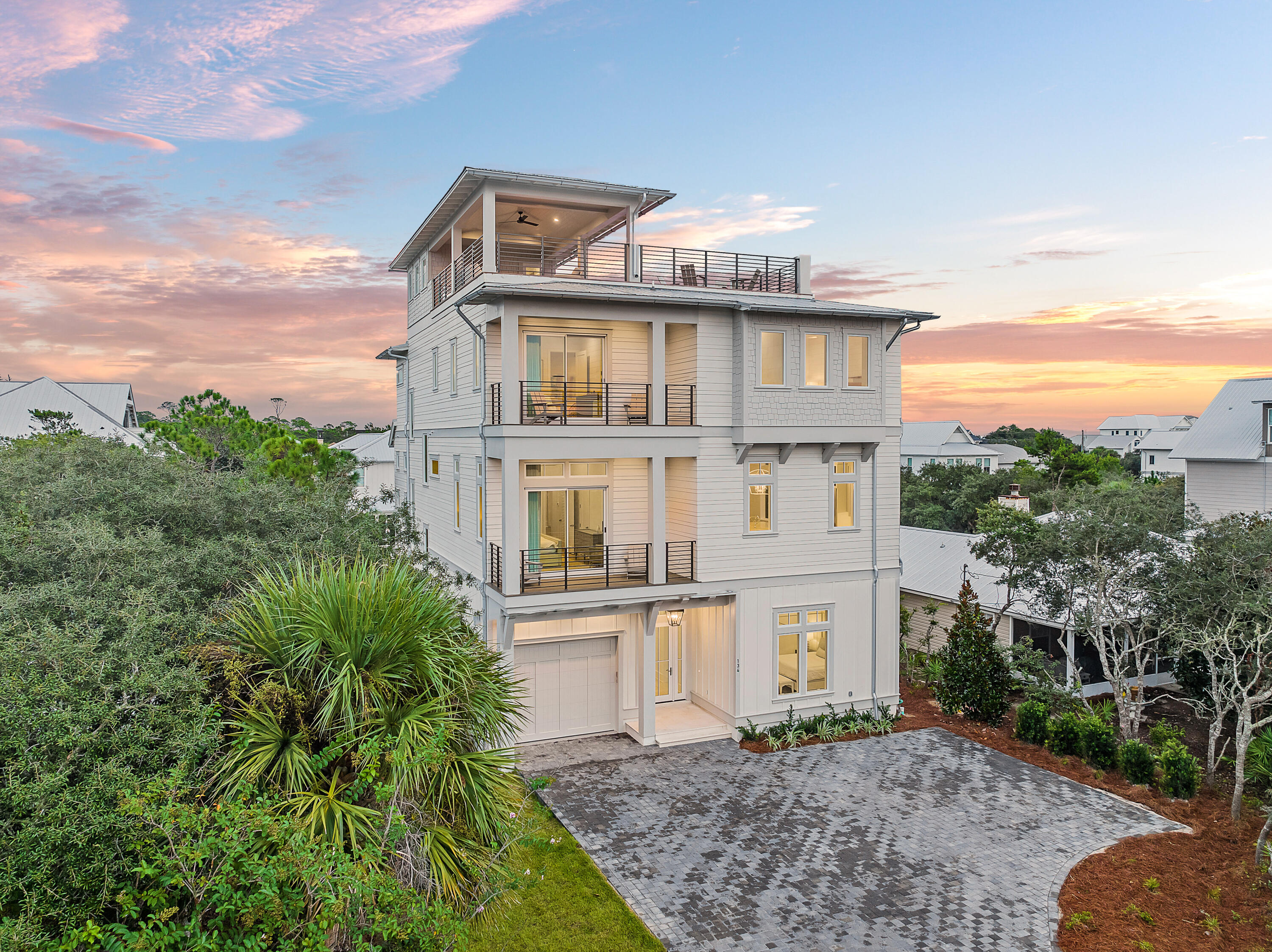 $200,000 PRICE REDUCTION AND LISTED $275,000 BELOW MOST RECENT BANK APPRAISAL! Welcome to 134 A Street - a stunning new construction home located on the desired east end of 30A that offers the ultimate in luxury living and potential rental projections of $440,000+! Offering 8 total bedrooms, this property is a dream come true for those seeking a lavish and comfortable lifestyle. Upon entering the property, you'll be struck by the beautiful custom tile and hardwood flooring throughout the home. The 12' ceilings on the 1st and 2nd floors create an airy and spacious feel, while the large kitchen with high-end Thermador appliances and a sizable island with two dishwashers is sure to impress even the most discerning of chefs. With multiple outdoor balconies, a resort-style heated pool with a raised large spa, and an outdoor covered Lanai area featuring an outdoor summer kitchen area, you'll have endless opportunities for entertaining and relaxation. The game room/living area on the 1st floor flows seamlessly out into the outdoor pool and Lanai area, making it the perfect spot for hosting gatherings and enjoying the 30A lifestyle! The property features two bunk rooms, one with 2 sets of full over queen and the other with two sets of queen over queen, as well as an expansive primary bedroom on the first floor. There are also eight full bathrooms, ensuring that everyone has their own space and privacy. The oversized rooftop deck is truly the pièce de résistance, offering amazing Gulf views and a covered area for entertaining with a wet bar and TV wall included. The 4 stop elevator to the rooftop deck makes it easily accessible for everyone. Other features of this property include two utility rooms, a garage, and custom tile and hardwood flooring throughout the home. Don't miss your chance to own this incredible piece of paradise on the east end of 30A! "
Nestled on the eastern edge of 30A, 134 A Street presents an enticing coastal lifestyle with its prime location. Residents can revel in deeded beach access, making leisurely trips to the shoreline a breeze. The proximity to Rosemary Beach, Alys Beach, Seacrest Beach, Kaiya Beach Resort, and 30Avenue ensures an array of options for dining, shopping, and entertainment, all within a short bike ride or stroll. Additionally, the allure of the Watersound Camp Creek Club awaits just around the corner, inviting membership for access to an impressive assortment of amenities. From exquisite dining and a top-notch gym to multiple pools, pickleball and tennis courts, and a variety of golf courses, this home promises an idyllic blend of relaxation and recreation.