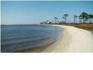 FULLY FURNISHED HOME, Perfect for Officer or family who wants to entertain! EMERALD POINT** Beautiful unobstructed PANORAMIC WATER VIEWS** From Master Bedroom* Lanai*Dining Room*Kitchen*Living Room** Lined with archways Giving it that beach cabana, yet elegant feel**all brick home**newer roof** custom upgraded 18'' travertine floors throughout looks like glass**all kitchen cabinets have cushion close drawers with beautiful granite countertops**very large kitchen with island of 9'5'' FT long breakfast bar overlooking kitchen & living room **top of the line stainless steel appliances** Gas stove comes with self cleaning convection oven. room for a built-in wine rack **many rooms have recessed lighting **ceiling fans throughout** 10'5'' high ceilings**lanai is lined with (3)12' sliding glass