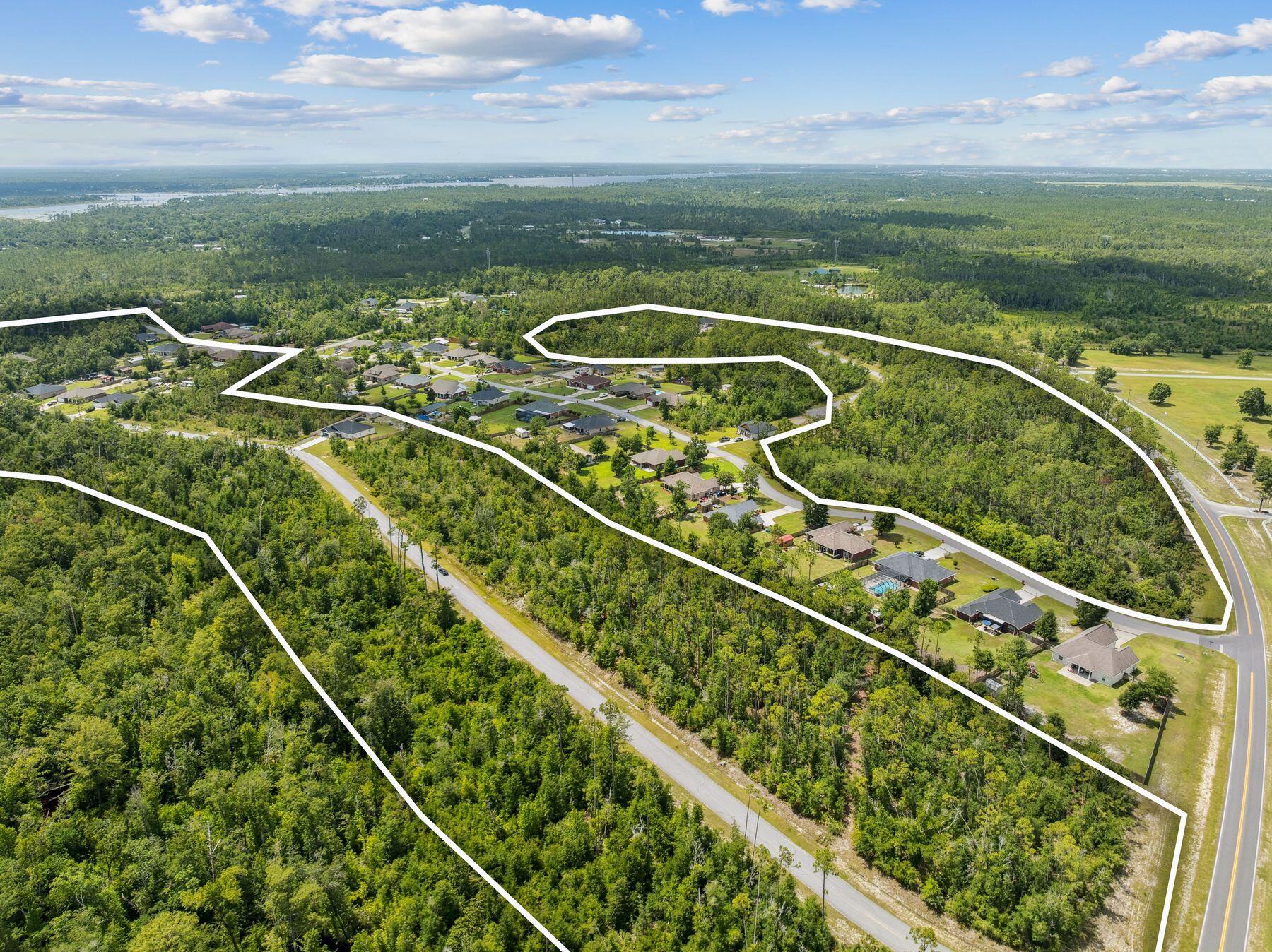 An exceptional opportunity awaits with this bulk offering of 70 oversized residential lots in the established community of Cedar Creek Chase. Ranging from one-half to three-quarters of an acre — and some stretching to nearly a full acre — these parcels offer generous room to build, expand and enjoy the peaceful pace of life in a natural setting. Many lots offer preserve views, and all are set within a quiet enclave just north of Panama City and east of the Northwest Florida Beaches International Airport.

With paved streets and water infrastructure already in place, the groundwork has been laid for future development. The area is currently on septic, and the rural charm of Cedar Creek Chase enhances the appeal for those seeking space, privacy and a slower rhythm. Located in Southport, this community offers easy access to the outdoor recreation of Deerpoint Lake and the white sand beaches of the Emerald Coast, along with proximity to local schools, shops and services.

This bulk sale represents the final developer-held inventory in a thoughtfully planned neighborhood known for its generous lot sizes, established greenery and enduring appeal. Whether held as investment or developed for resale, these remaining lots offer immediate potential and long-term value in a growing section of Bay County.