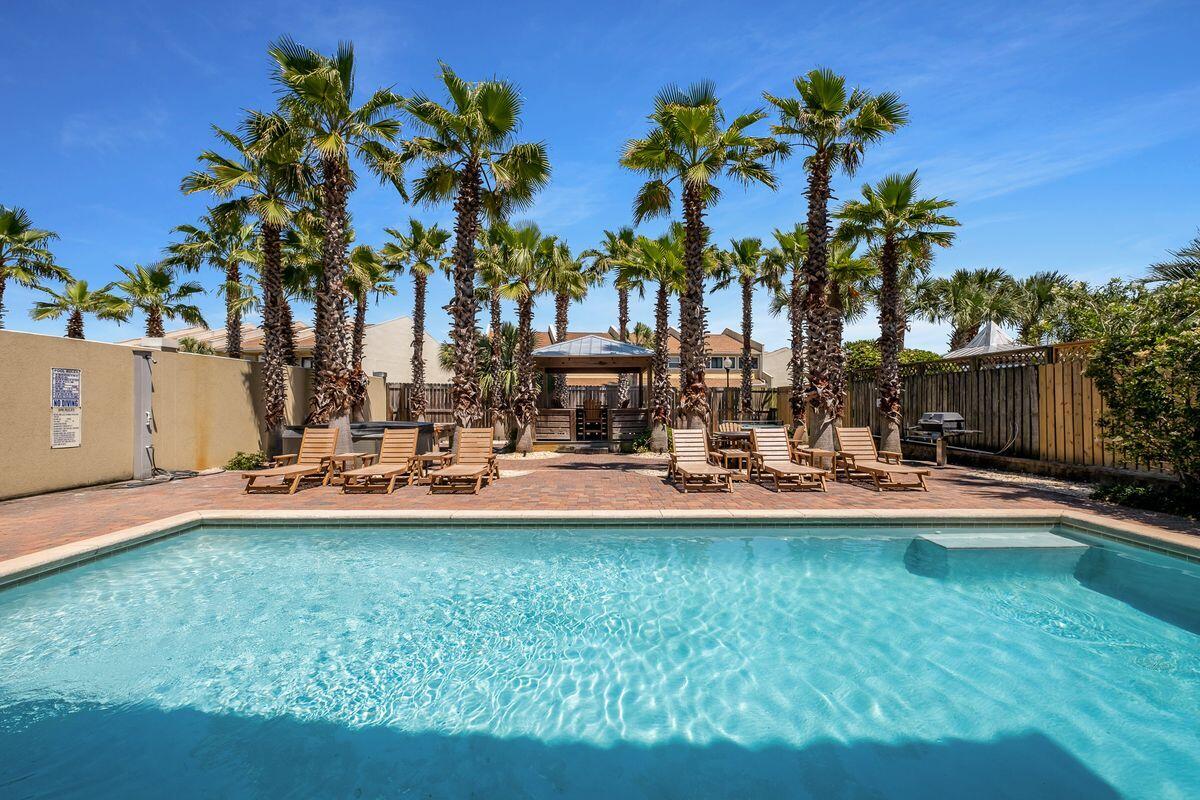 ''The Silver Peso'' is a five bedroom beachside retreat, just over 3,300 sq ft of living space, located in the well established community of Frangista Beach. A top producing home with over $215,000+ of rental income on the books YTD 2021. 62 Miami Street conveys fully furnished and has been beautiful decorated with coastal decor and furnishings throughout. Notable features include multiple living spaces, tile flooring throughout, two car garage, two bunk rooms, tons of outdoor and balcony space and a true backyard oasis with a large private pool, palm trees, ample privacy, beautiful landscaping, outdoor shower, plenty of space to relax, hot tub, a tiki hut and BBQ area. The first floor features two bedrooms including queen over queen bunks, laundry room as well additional hallway bunks. The first floor alone can sleep up to 10 guests. The second floor features the main living areas including a wet bar area with ice marker, master suite and ensuite bath and one half bath off the kitchen and living area for guests. The kitchen is fully equipped with granite countertops, ample storage space and cabinetry and a breakfast bar for seating of four. Three sets of beautiful French doors opens up to the balcony off the living room, overlooking the backyard and pool. The master suite has beautiful flooring, tons of natural light and opens up to its own private balcony. The master bath is complete with dual vanities, soaking tub and separate shower. The third floor features a secondary living area with couch and TV and two additional bedrooms, one being an additional master suite, each with their own ensuite full bath and balcony. This home is an excellent rental property or second home with close proximity to deeded beach access and numerous world class restaurants, shopping, Whole Foods and ability to easily jump on Scenic 98 for a bike ride or morning walk.
