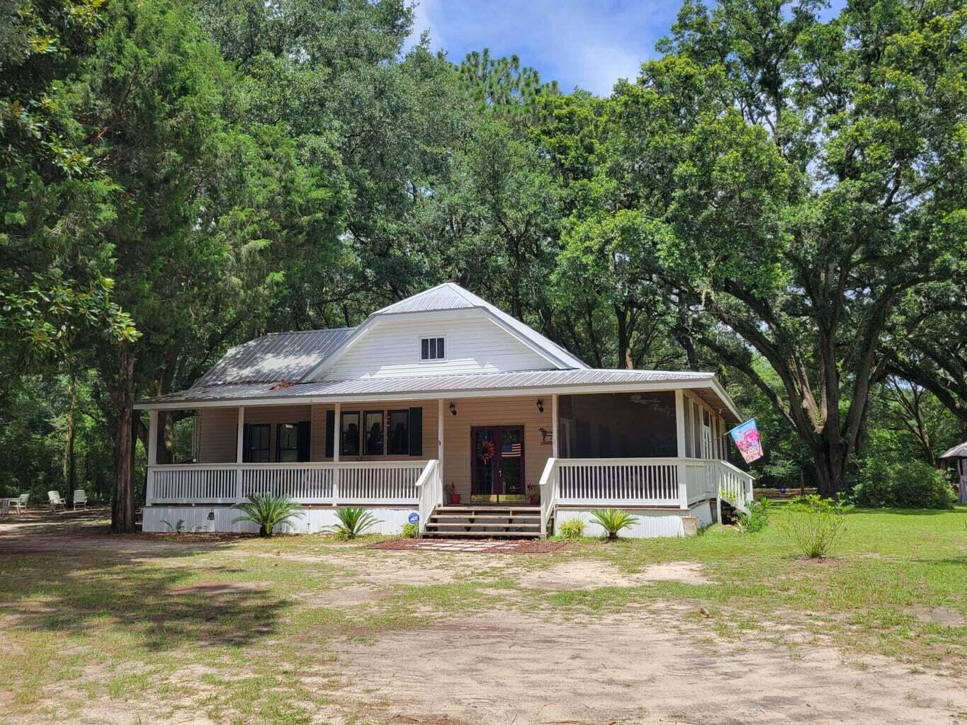 Florida Southern Cottage style home with tall 10 feet interior ceilings and Large L shaped outdoor partially screened Porch area. 2359 sf under roof total. 2 large bedrooms and 2 baths.
Laundry room is in home in back area next to master room and access from screened porch area as well. There is a large Den area or Formal entry that is a host that could easily be used as an addition Bedroom or office. Also there is a large unfinished area in the attic that possibly could be used for extra storage . Beautiful property with large oaks surround and very charming. Owners are looking for well qualified tenants , minimum credit scores will apply.
Easy application process. There are pet restrictions and limits.
