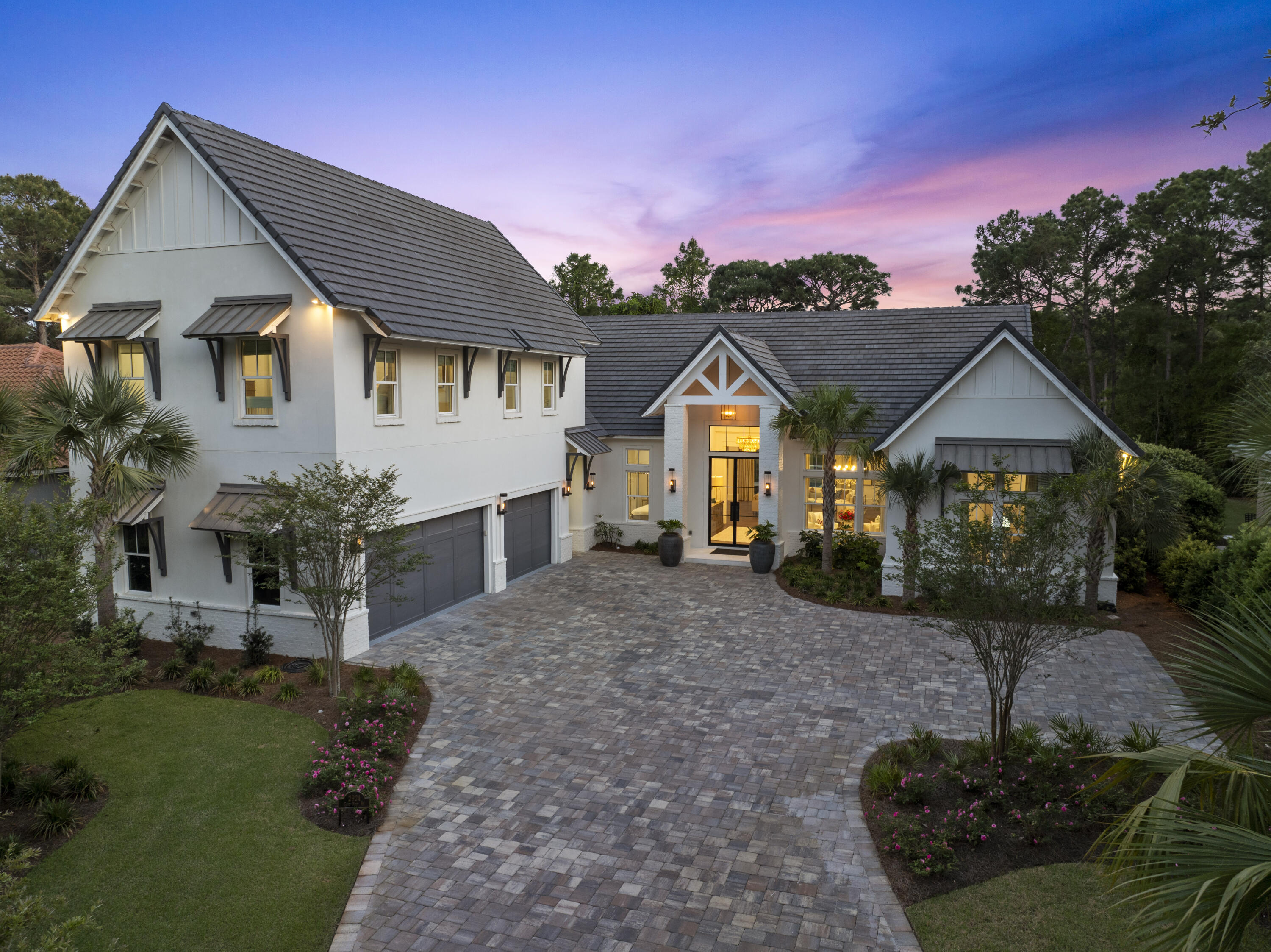 Experience luxury living in this custom-built 4-bedroom, 5-bath home nestled on the prestigious Burnt Pine Golf Course within Sandestin Golf and Beach Resort. From the moment you arrive, the striking modern design sets the tone with elegant gas lanterns, grand 10' entry glass doors, and lovely paver driveway that welcomes you to a one-of-a-kind sanctuary. Inside you are greeted by soaring 12'-15' ceilings, with a dramatic 20' cathedral ceiling in the main living area, centered around a stunning shiplap fireplace wall with mantel. Designed with entertaining in mind, the open floor plan seamlessly connects the expansive great room to a gourmet chef's kitchen complete with a 10' island, top-of-the-line Miele and Thermador appliances, including a 48'' dual-fuel range, two ovens, icemaker, double dishwasher drawers, a 6' built-in refrigerator/freezer, and a butler's pantry. A stylish wet bar with wine fridge, cooling drawer, and an additional ice maker adds to the home's entertaining appeal. Beautiful wood flooring flows throughout the residence, leading you to a luxurious primary suite featuring a cathedral ceiling, private sitting area and 10' Eurowall doors that open to the pool and courtyard. The spa-like bath is equipped with a large soaking tub, oversized shower with electronic controls, smart toilet, and an expansive custom closet with its own washer and dryer. A dedicated HVAC system, dual tankless water heaters, and automated Lutron shades and Forest Drapery ensure ultimate comfort for the primary retreat. 

Two spacious bedrooms with en suite baths and a grand foyer round out the first floor. Multiple access points open to the private courtyard, where a resort-style pool, hot tub, and waterfall feature are the centerpiece of the home's outdoor living area overlooking hole 7 of Burnt Pine Golf Course. The screened lanai features an impressive 23' cathedral ceiling with white painted brick, an electric fireplace, electronic screens for easy access to the pool and a full outdoor kitchen outfitted with a gas grill, side burners, warming drawer, island with sink, icemaker, fridge/freezer drawers, and a dishwasher drawer.

The second-floor guest suite is accessible by stairs or elevator and features a private living room with cathedral ceilings, a full kitchen with GE Café appliances, a large bedroom with en suite bath, walk-in closet, and its own laundry area, perfect for guests or multi-generational living.

Additional standout features of this exceptional home include an oversized garage with 3 EV charging stations, 4 tankless water heaters, open cell foam insulation for energy efficiency, a large walk-in pantry and dedicated laundry room on the main floor, outdoor motorized retractable shades on the lanai, and the home is equipped with state of the art systems from Sonos to top of the line security and Wi-Fi systems. 

Boasting just under 5,600 sq ft with 4,500 sq ft of ground-floor living and an elevator making it easy to access the second floor, this stunning custom-built home offers a phenomenal opportunity for modern luxury living in a premier golf course and beach resort setting. This mesmerizing home is in a prime location within the renowned Burnt Pine community, which is in close vicinity to the Choctawhatchee Bay, along with easy access to Baytowne Marina, and the designated Sandestin beach along the emerald waters of the Gulf. Burnt Pine is the exclusive, gated community of Sandestin Golf and Beach Resort and offers many first-class amenities, fine dining and fun entertainment options, as well as an award-winning golf course!
