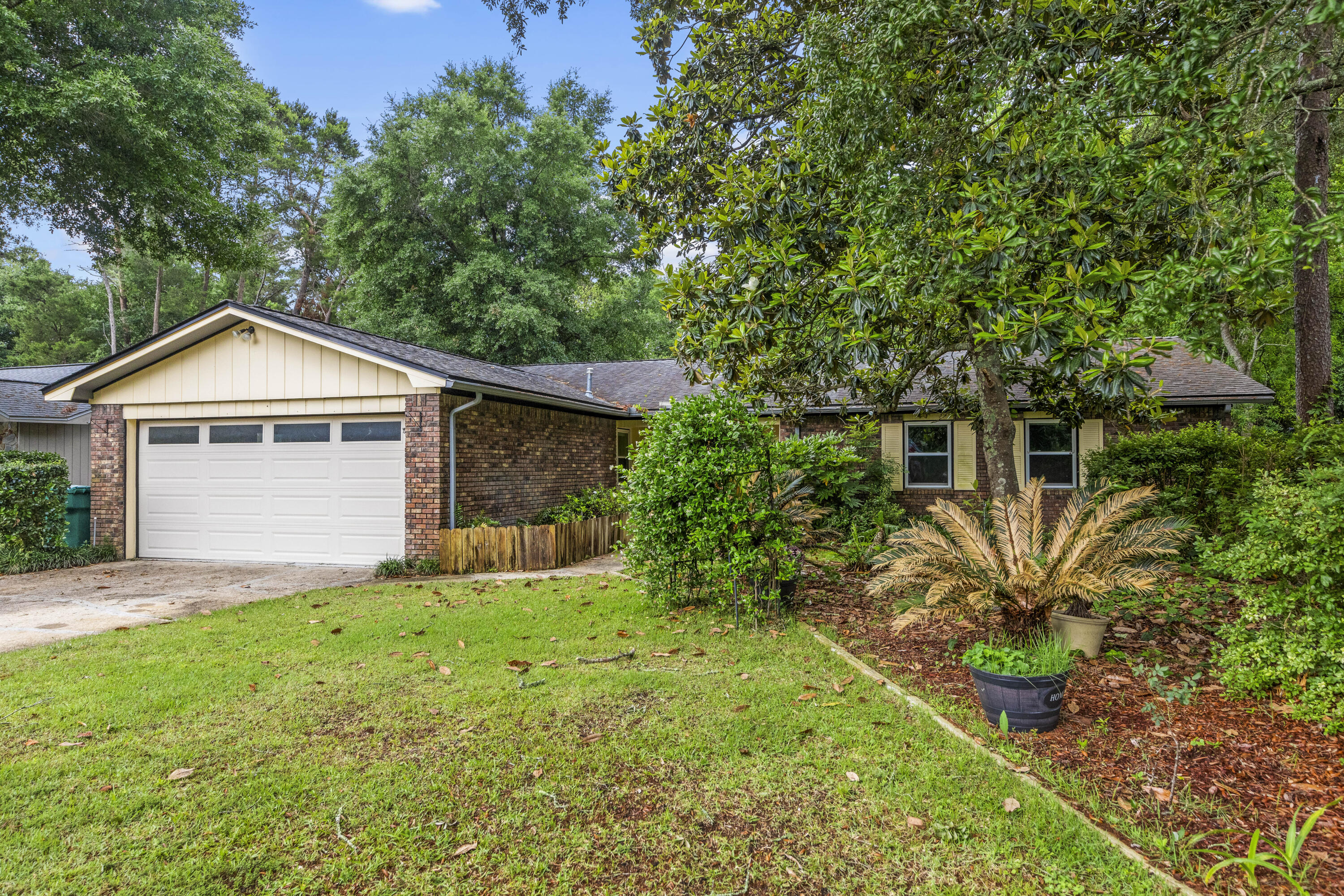 This lovingly maintained home in Bluewater is ready for your family to make it your own. Long time owners replaced all the windows in 2018, installed a new HVAC system in 2017 and replaced the roof in 2013. A new tiled shower was also added to the master bath and the second bathroom has a walk-in tub. Garage and Florida room floors have recently been refinished with premium durable resin polyaspartic flooring. The efficient u-shaped eat-in kitchen has warm wood cabinets, corian countertops, glass tile backsplash and stainless steel appliances. Stainless steel washer and dryer matched set also convey. The focal point of the family room is the brick wood burning fireplace and the adjacent dining area could also be used as an office. The large lot has lots of mature landscaping with both hardwood and tropical trees, a coi pond in the backyard, deep well irrigation system and is fully fenced. Don't miss this opportunity to enjoy the amenities of living in Bluewater Bay!