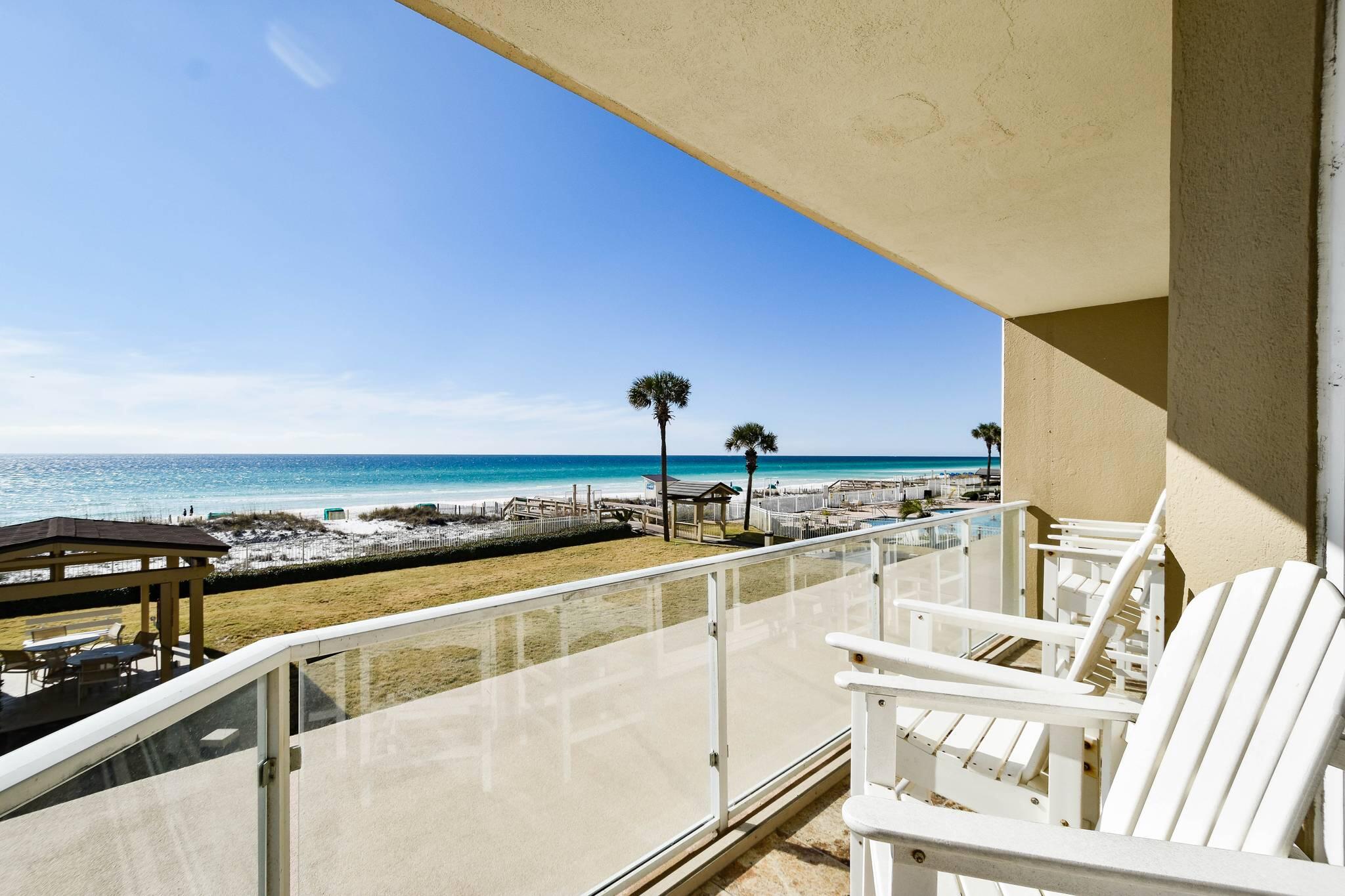 Question: When you have an East Corner Unit with a South & SW (sunset) view, a wrap-around balcony, what do you get?  You get the same full view of the Gulf as a SW unit, with the option to retreat from the hot afternoon sun....and lower energy bills as a result!  One more:  When your unit on the first floor is actually on the second level, what else might you enjoy?  The benefit of no wait for the elevator (for you or your dog!) and only about 15 steps to the ground level/pool/BBQ Area and community's deeded-beach access!  What the heck...one more:  When your 3-bedroom unit is a full 2-bedroom, connected to a separate/lockout 1-bedroom efficiency, with a private Gulf-view balcony, what do you have now?  Greater income potential, as it may be enjoyed as a 2-bed unit AND a 1-bed unit...or a 3-bedroom unit.  Hence, a larger rental audience and a higher ROI potential as an investment, than just one unit combined.  Plus, you can enjoy a great getaway for yourself, while receiving cash-flow from the other portion of the property!  This tastefully-decorated unit has an truly "open" feel to it, conducive to comfortable and enjoyable interactions for your entire group!  Recent upgrades were completed on the building, contributing to the overall attractive, value and longevity of the complex.  Incidentally, this building is VA approved for 2023.  Don't miss this one!