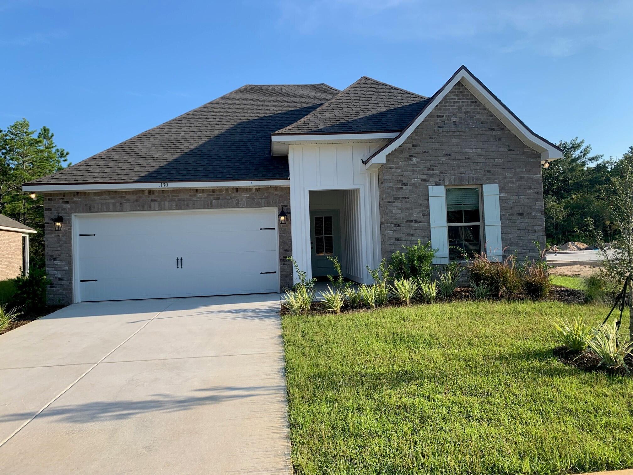 The TRILLIUM III G in Moonswept at Hammock Bay community offers a 3 bedroom, 2 full bathroom, open design.  Upgrades added (list attached).  
Features:  double vanity, garden tub, separate custom tiled shower with frameless door, and walk-in closet in the master suite, covered patio, recessed lighting, undermount sinks, framed mirrors, smoke/carbon monoxide detectors, landscaping package, architectural 30-year shingles, flood lights, and more!
Energy Efficient Features: water heater, kitchen appliance package, vinyl low E windows, and more!