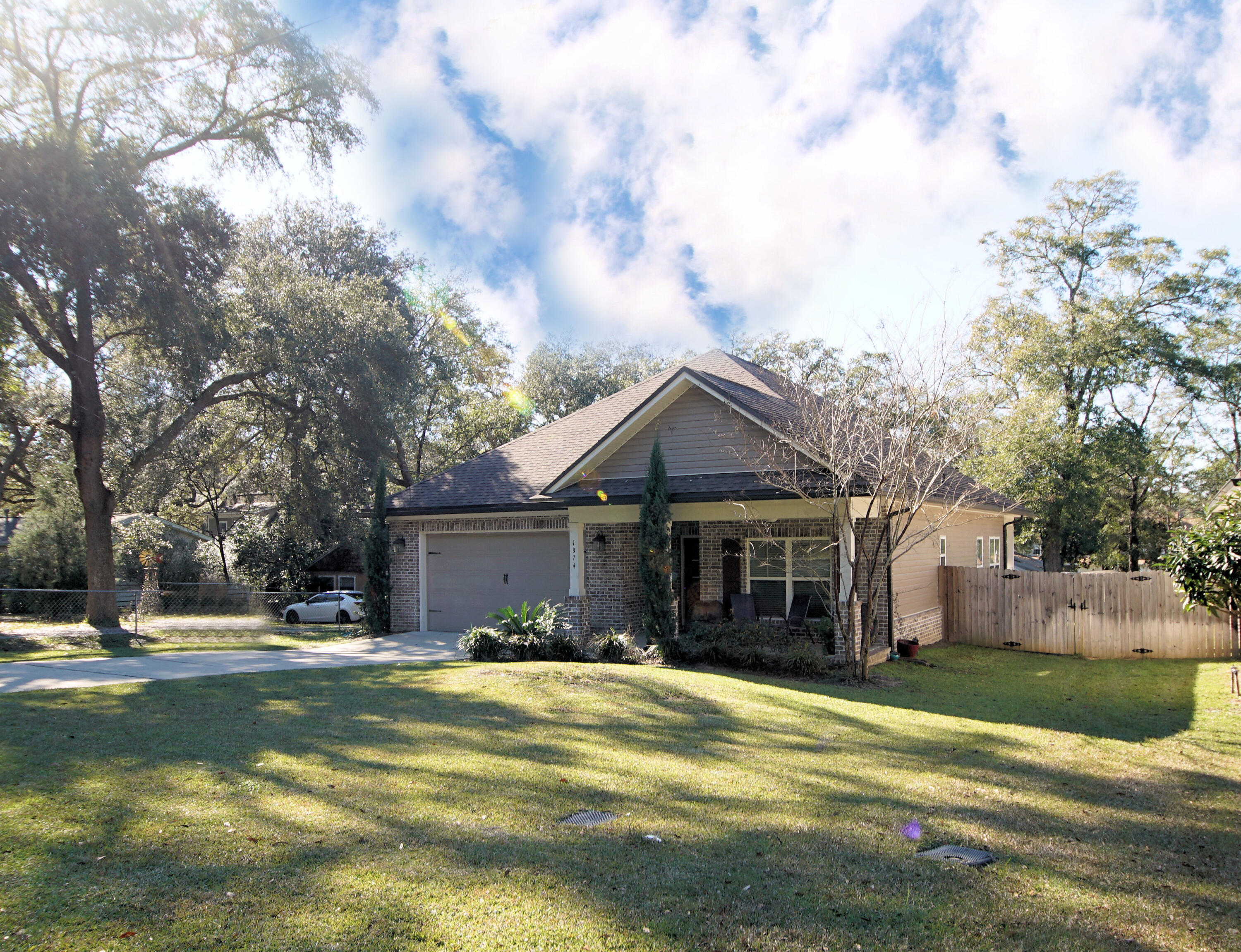This lovely Randy Wise Craftsman Style home was built in 2016 and is ready to move in.  Great location in the heart of Niceville, near shopping, schools, with easy access to Destin.   Open floor plan with three bedrooms and two baths. The kitchen has lots of cabinets, a large kitchen island, granite countertops and stainless appliances. The flooring is laminate wood plank in all common areas, carpet in the bedrooms and tile in the bathrooms and laundry. The backyard includes a covered patio, open paver patio and privacy fence.  All this with a two-car oversized garage. Home will be professionally cleaned to include carpets prior to closing.  Call to tour this hidden gem today!