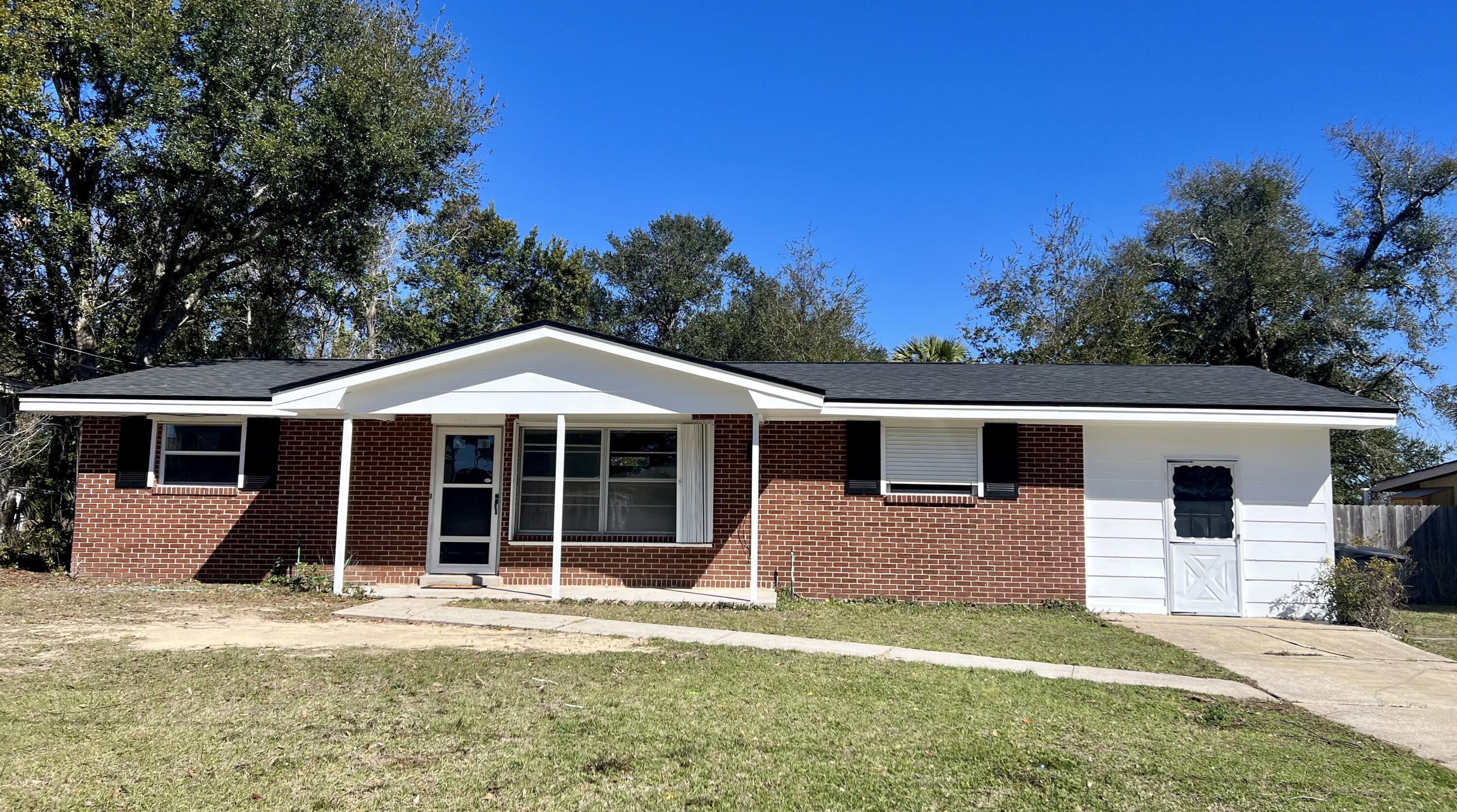 Cute brick starter home or potential investment property with wonderful recent updates!  If you're looking for a great deal; look no further! This home is located in Mallory Heights subdivision that is loaded with timeless charm of brick, ranch styled homes and offering a wonderful playground and park to enjoy with your loved ones. You are welcomed to this enchanting home by a decently sized lot that is shaded with mature trees and accented with quaint white shutters. Inside you are welcomed to a wide-open living space with new LVP flooring that flows wonderfully to the adjoining dining area and kitchen.  Adorable character is seen by the exposed brick wall that perfectly separates and compliments the living and dining area. This crafts a perfect setting for any intimate gathering. The kitchen features plenty of counter space, black cabinetry, and easy to care for laminate countertops. Hosting and extended guests will be made a breeze, with its ideal split floorplan as well as all NEW carpeting in the living room and a bedroom. To the right of home, you will find the owners suite that features chic parquet flooring amidst the spacious room, ceiling fan, and abundant closet space. To complete the master, is an adjoining full ensuite that consists of a convenient walk-in shower and single tidy vanity. The other two guest rooms can be found opposite the home and are both reasonably sized and share a neighboring full bath between, with a shower/bath combo. Wonderful large screened-in porch off the back of home that makes a great addition for sitting in your comfy patio furniture, guarded from all the elements. You'll find access off the screened porch to a generously sized utility, laundry room, or additional storage area. Recently cleared, private backyard and serves as a blank canvas for all your landscaping ideas! This home is centrally located to everything in Pensacola including beautiful white sandy beaches and the bay, Colleges, shopping, eateries, and entertainment. This home has a lot of life left and waiting for you to make it a HOME! NEW ROOF! NEW HVAC! NEW GAS WATER HEATER! NEW FLOORING! NEW PAINT INSIDE AND OUT! ALL NEW JUST FOR YOU! Make this one yours, before it is gone. Call today for a private showing.
