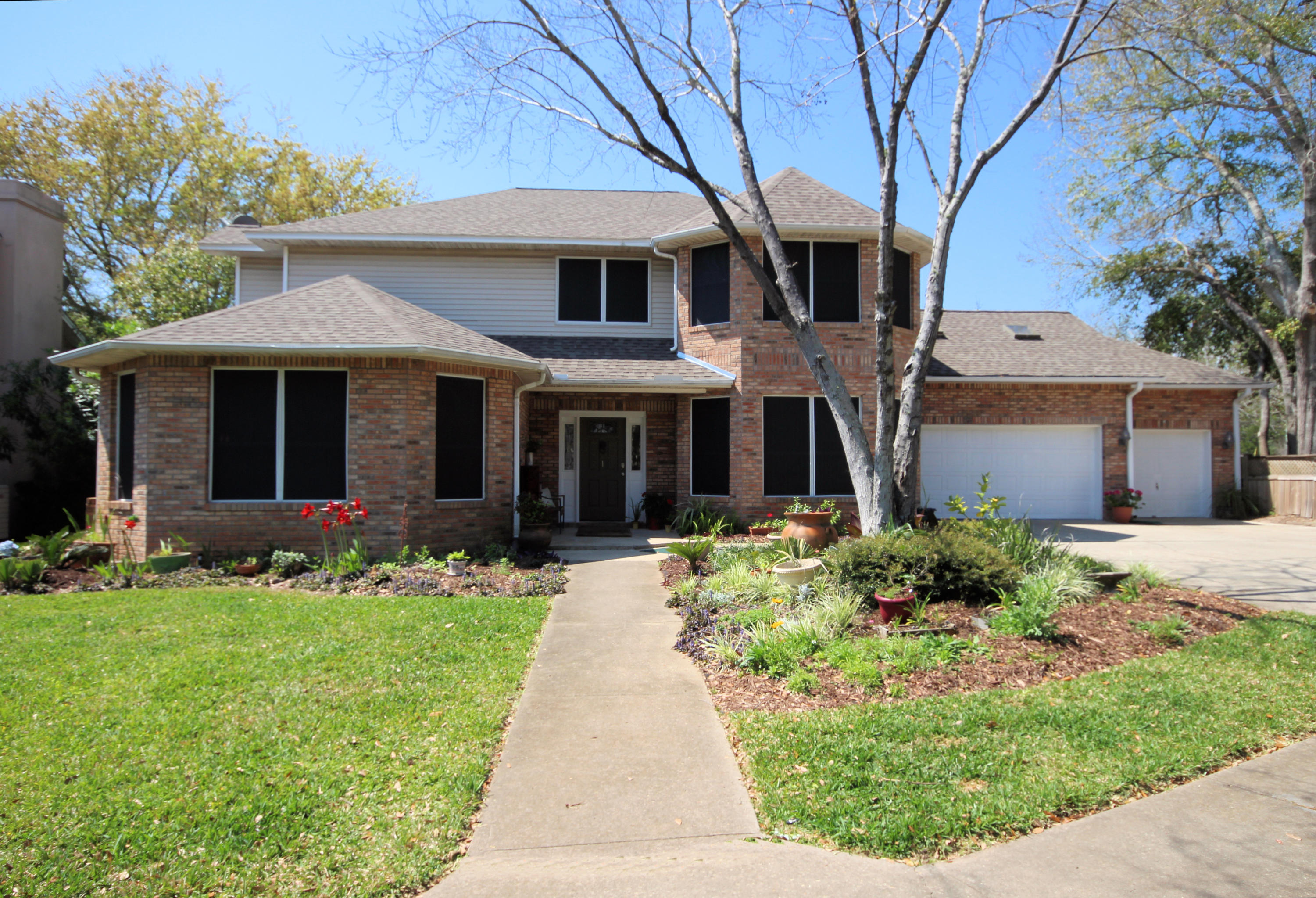 Gorgeous, move-in ready, two-story, brick home with 5 bedrooms, 4 baths and 2804 sq ft located in the desirable, waterfront community of Islandview in Mary Esther, FL! The community provides deeded water access on the Santa Rosa Sound and an amazing waterfront lifestyle! Enjoy fishing off the community dock, lounging on the white sandy beach, paddle boarding, jet skiing, boating, and watching sunsets! This community also features a gunite pool and boat slips. Boat slips can be rented for a nominal fee and there is currently a short waiting list. The home is a short distance from the Sound and is centrally located to restaurants, beaches, shopping, and great schools! With a 3-car garage and a double gate to the side yard, there is plenty of parking for vehicles, a boat or RV. Pride of ownership shows in this immaculate home! The kitchen features custom cabinetry with crown, 20' ceilings, a new wall-oven and microwave (2014), a new black composite granite sink and brushed nickel faucet (2015), a new stainless dishwasher (2015) and a side-by side stainless refrigerator (2014). The kitchen also has an island with a Jenn-Air cook top for cooking and entertaining guest! The kitchen opens to the dining room and living room areas! The dining room and living room feature trayed ceilings and bamboo wood flooring. The living room has large picture windows, side lights, and French Doors leading to a courtyard style backyard.  There is gas available for a fireplace in the living room. The master bedroom also features trayed ceilings and large picturesque windows.  The 5-piece master bathroom features a cultured marble, spa tub, walk-in shower, water closet, a make-up counter, and two separate vanities. In addition there is a large walk-in closet with built-in shelving! On the first floor of the home there is also a bedroom that would be perfect for a home office. Next to the bedroom is a full guest bathroom and a laundry room. The laundry room features a storage area, folding area, utility sink, and corner nook for additional storage space! Upstairs the home features an additional three bedrooms, two full bathrooms and a bonus room.  The bonus room has a wet-bar, skylights, and an attic walk-out storage area.  There is a spacious Jack and Jill bathroom connecting two bedrooms. The exterior of the home is lovely! There is a large deck area in the backyard with a privacy fence that also wraps around the side yard. The fence has a double gate which allows for boat/trailer parking in the side yard. The sprinkler system is on well water, has coverage for both the back and front yard, and has a newer sprinkler pump (2014). The roof was installed in 2014 along with 6-double paned window components. The home has two gas furnace HVAC units and two gas hot water heaters. The home owner also added solar screening to the windows for maximum efficiency and sodded the front and side yard with Saint Augustine! This waterfront community offers deeded water access on the Santa Rosa Sound, a private beach, community pool, gazebo, and a community dock! Enjoy night fishing from the dock with the underwater fish lights. Seller is offering a one year home warranty for basic coverage. Buyer to verify all information and dimensions.