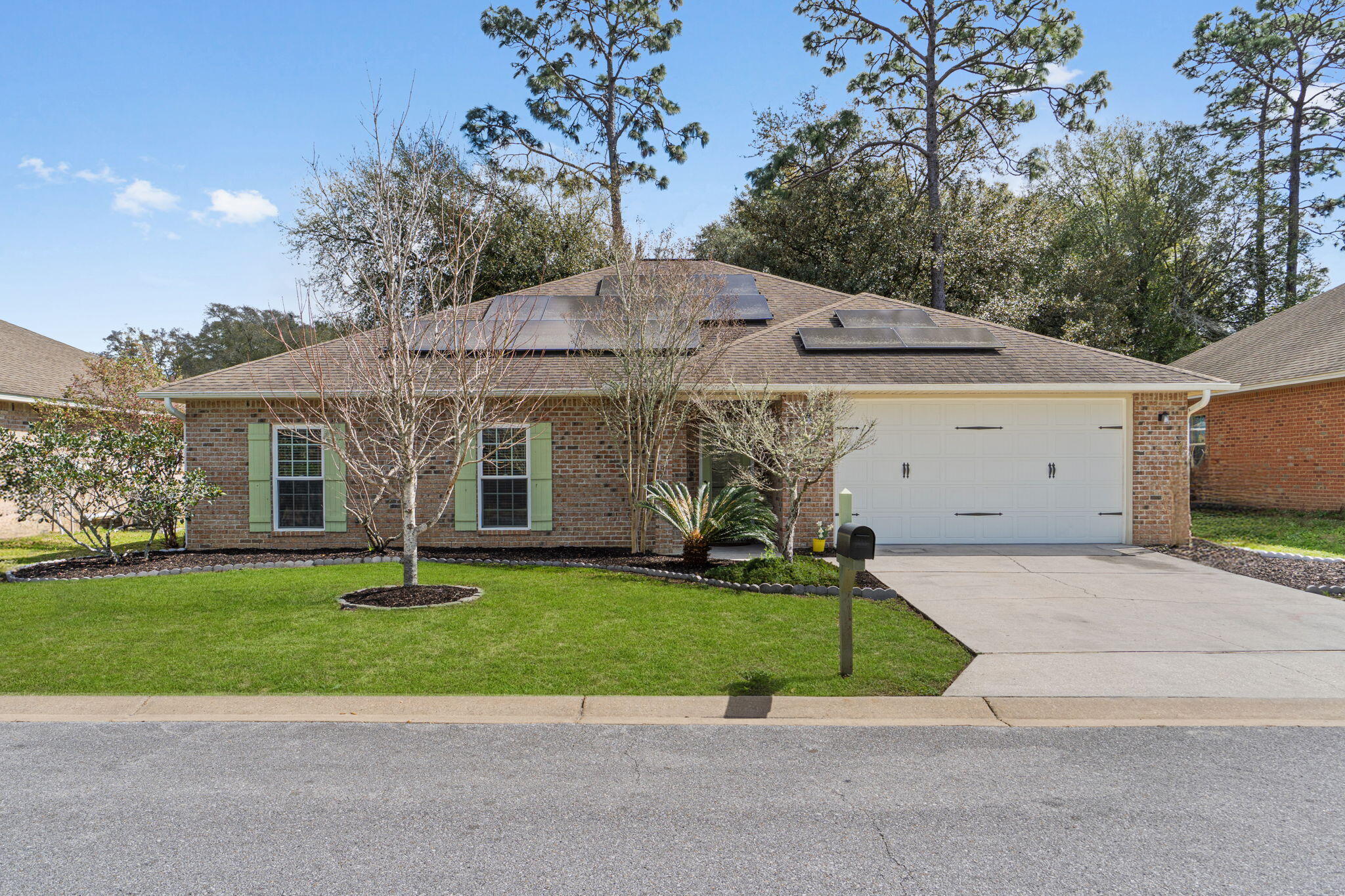 Fresh updates, solar panels that convey @ no cost to the buyer, and a location just minutes from 7th Special Forces Group & Eglin AFB: this South Crestview home delivers space, efficiency, & convenience. Recently refreshed w/new carpet, whole house interior repaint, professional deep cleaning, pressure washing, and updated landscaping, this 5-bedroom, 3-bath home offers nearly 2300sqft w/granite countertops, stainless appliances, & a spacious primary suite with soaking tub/ separate shower. Located near the 1st stoplight in Crestview, making commutes to base easy and placing you about 30 miles from the white sand beaches of Destin. Ideal for military relocation or PCS buyers seeking space and value along the Emerald Coast. VA Assumable Rate of 2.875% for qualified Buyers. Ask for details!