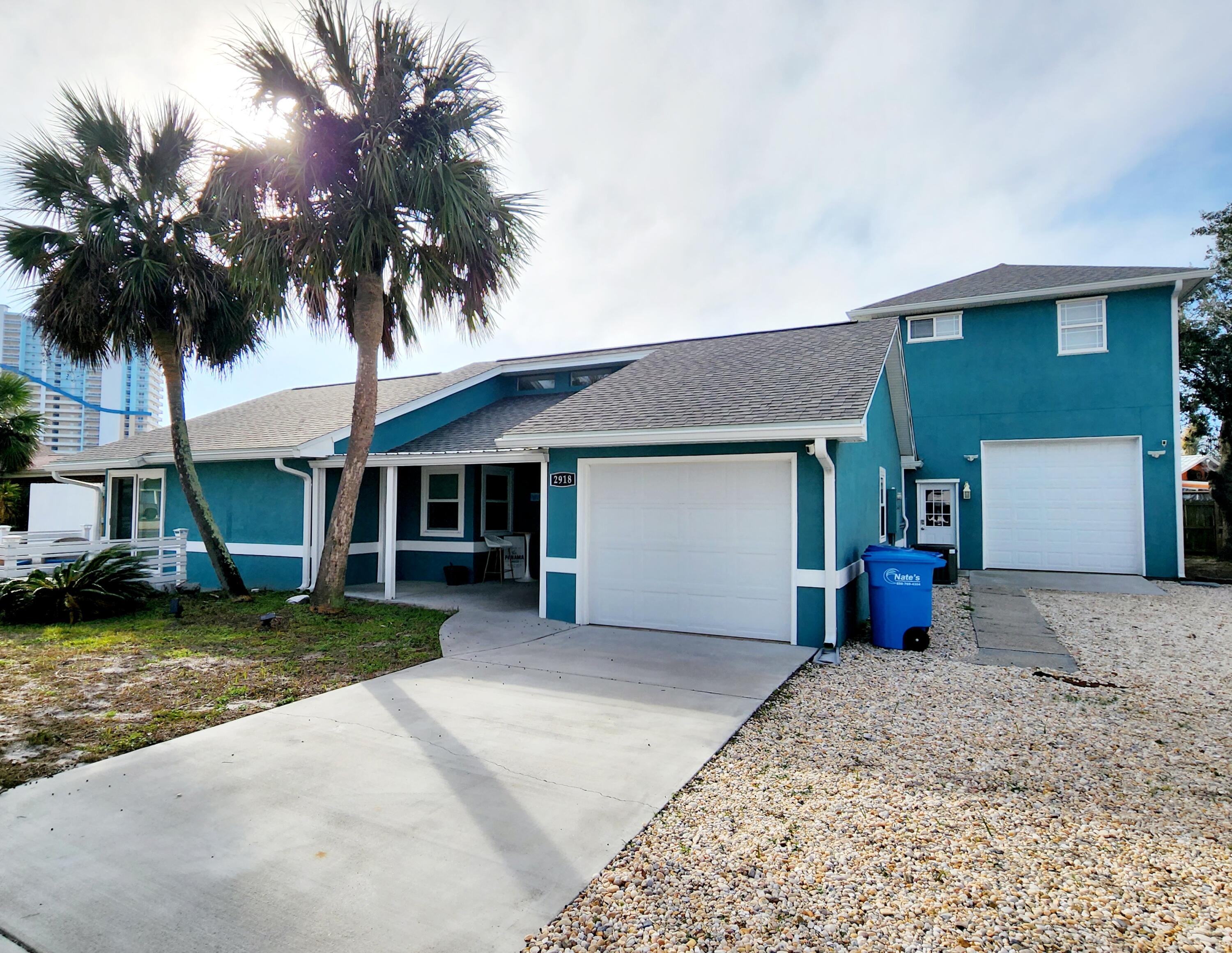 CURRENTLY UNDER CONTRACT, SELLER WILL CONSIDER BACKUP OFFERS. The name says it all! Welcome to Panama Paradise Too! This beautifully decorated property gives the true feeling of relaxation and being at the beach from the moment you step foot on the property. With the open floor plan, accented shiplap walls, quartz countertops and dining table, stainless steel appliances and even its own game room. The saltwater pool is steps from the living room and an awesome place to swim or just enjoy the tranquility of your own private oasis while hanging by the pool watching the game on the outdoor projector screen. This property even has a detached in-law suite that is fully equipped for accommodating large families. Did I mention that the public beach access (#5) is just minutes from the world famou Mexico. Not only is the beach just minutes away but several local restaurants and shopping as well. The property has been completely remodeled in 2021. Currently sleeps 10. Comes fully furnished and turnkey rental ready! Grossed over $90K in 2022! The sale even includes a golf cart. Schedule your showing before it is to late. This property will not last long!