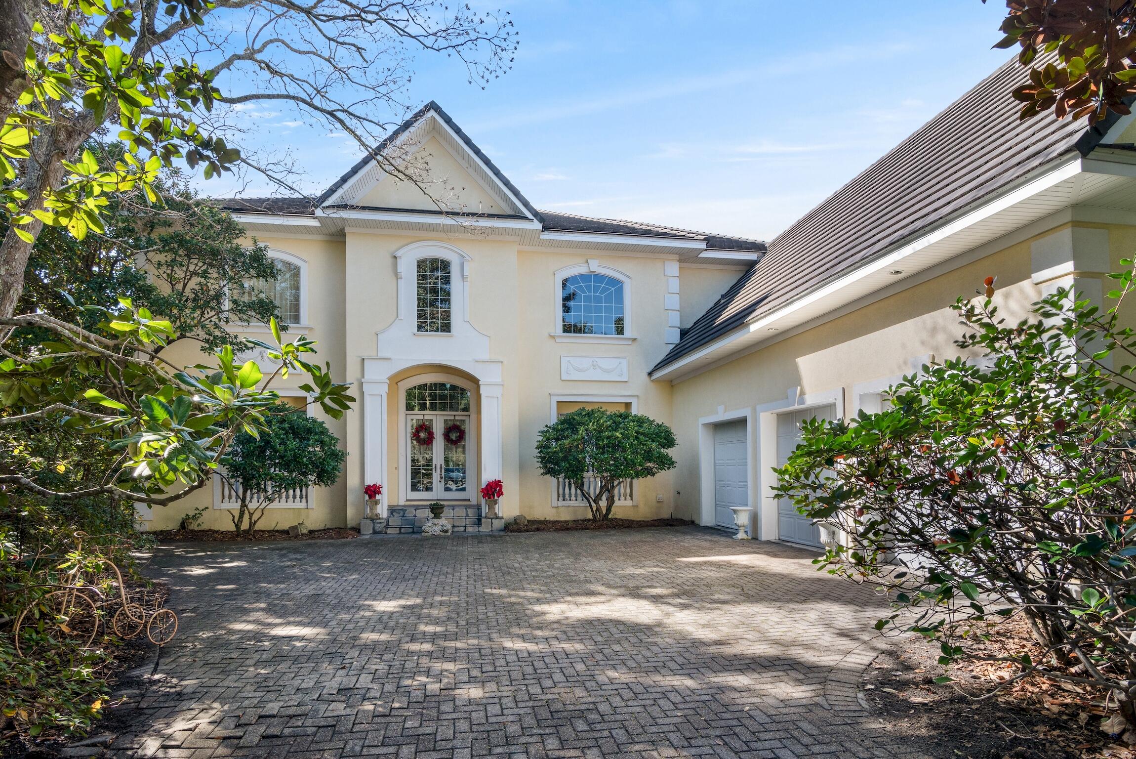 Looking for a home for your deep-water boat? Plus, a home with timeless elegance? Come see this French-style 5900 square foot home at 4370 Old Bayou Trail in Destin's beautiful Kelly Plantation neighborhood, where you will find not just ample space, but a lifestyle of luxury, comfort and beautiful sunsets. Views from the open plan kitchen, breakfast area and den all look out over Indian Bayou and your own dock. Furnish with a few Adirondack chairs and you'll be ready for fishing and catching crabs! Kelly Plantation has many different neighborhoods - The Plantation neighborhood is welcoming and home to many year-round neighbors. Within a short walk you'll find...Click on 'more' to continue a community garden, playground, pickleball courts, miles of walking trails, nature preserve and freshwater lakes. Enjoy summer concerts at the Mattie Kelly Arts Foundation pavilion. Feel secure with guard houses at both entrances and take comfort in knowing your children are served by good schools - including a new high school. 
The Kelly Plantation golf course is consistently rated as one of the best in Destin. Designed around miles of waterfront, bayous and the trees of the former turpentine plantation, the course is beautifully manicured with panoramic views of the Choctawhatchee Bay. The golf and owners club houses offer great dining,, fun community and holiday events, a newly equipped gym, large pool and community rooms. And just outside the gates is Henderson Beach State Park with some of the most beautiful beaches anywhere. 
Strategically nestled away from crowds, this neighborhood delivers quick and stress-free access to all shopping without having to get on Highway 98. Making this home a dream for those seeking an oasis that boasts convenient living right in stunning Destin.

The home itself has four large bedrooms and 3.5 bathrooms each beautifully designed with interesting pieces from around the world - including beautiful wallpapers, antique Dutch tiles, a soapstone farmhouse sink and a pretty sunflower ceramic sink in the wet bar area upstairs. The whole first floor has Italian limestone floors throughout, including primary bedroom overlooking the bayou, and bathroom which includes a marble shower, jacuzzi tub, custom wood cupboards and a fireplace. As you enter the home, there is a large office also with custom cabinetry.  
The large scale of this home provides ample storage, a vast bonus room over the garage and the flexibility to make these spaces your own. The 3-car garage also has plenty of space for storage, a separate tool closet and room for a golf cart or two. 

The heart of this home is a spectacular kitchen which flows comfortably into the breakfast nook and den, perfect for large family gatherings. The more formal living room has space for multiple seating areas and a dining table to easily seat 12 or more. With picture windows framing breathtaking views of the bayou, sunsets, and your own dock, you wouldn't want to be anywhere else.

This classic and elegant home is offered at a very competitive price per square foot, with an open plan for you to adapt to suit your family's needs. Schedule a showing or contact us for more information and grasp this unique opportunity to own a piece of paradise. Your dream home awaits!