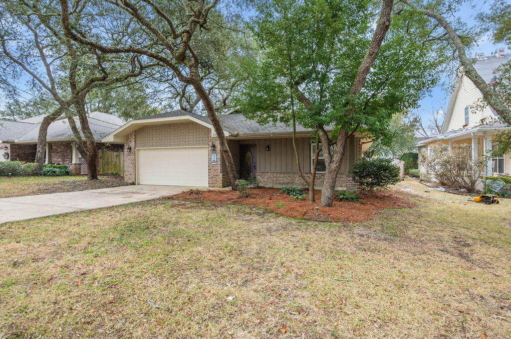 NEW PHOTOS!  FRESHLY PAINTED INTERIOR!!  Centrally located in the heart of Niceville! This  4-bedroom, 3-bath home offers space, comfort. Short commute to Eglin AFB.  The custom kitchen features abundant cabinetry, granite countertops, breakfast bar, and a commercial-grade refrigerator/freezer. Enjoy a spacious great room, separate dining area, and a split floor plan for added privacy. Crown molding in Kitchen, great room and master bedroom. The master suite includes his-and-her walk-in closets, double vanities, and a separate shower with a relaxing jetted tub. With just a touch of fresh paint and new carpet, this home can be perfectly personalized to your taste. Easy-living floor plan in a prime location--don't miss this opportunity!