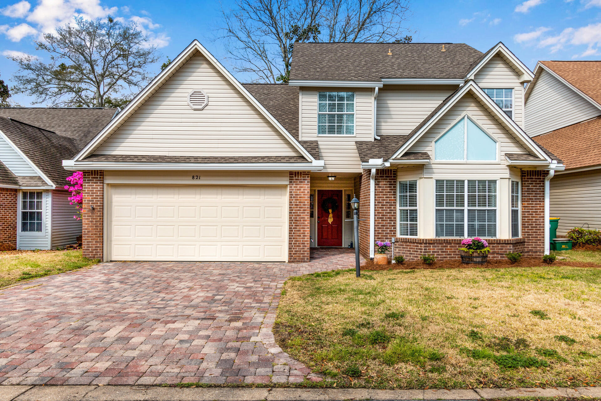 Fabulous in Fairway Lakes! Welcome to this beautifully updated 4 bedroom, 2.5 bath home in the heart of Bluewater Bay - close to tennis, golf, pickle ball, community pools, marina, and more! The updated paver driveway welcomes you in from the quiet residential neighborhood of Fairway Lakes and as you step inside, you'll find an open concept floor plan with soaring family room ceilings, GORGEOUS updated kitchen, dining space, fireplace, and neutral paint. Downstairs is a half bath tucked below the stairs and the primary suit features a large bay window, new ceiling fan, and ensuite with dual vanities, tiled shower, and walk in closet! The fully renovated kitchen boasts a large island with storage, granite counters, new cabinets, tumbled stone backsplash, and stainless appliances. CLICK MORE Through the sliding door off the dining room you'll love the screened porch for relaxing with your morning coffee that leads to the fully fenced and shaded backyard with mature trees, garden beds, and room for pets and kids to play! Upstairs, find 3 additional bedrooms with ample closet space, great natural light, and a full bath with tub/shower combination. Zoned for Bluewater Elementary, Ruckel or Destin Middle, and Niceville High School this wonderful home is only a few minute drive over the mid-bay bridge to all that the Emerald Coast has to offer! Roof 2015, HVAC 2015, WH 2022, active termite bond with Southland Pest, Old Survey available, Washer/Dryer convey, Fireplace cleaned 2022, Back Gutters 2020, Fence 2019