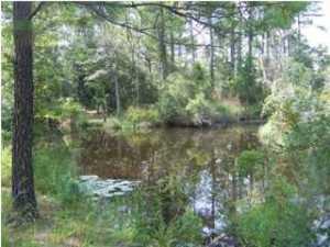 OVER HALF AN ACRE ON DEEPWATER CANAL LEADING OUT TO BEAR CREEK AND JOLLY BAY. LARGE NEW HOME UNDER CONSTRUCTION ON ADJOINING LOT. UNOBSTRUTCTED VIEWS OF JOLLY BAY. SELLER HIGHLY MOTIVATED. SURVEY AVAILABLE. All reasonable offers considered. Listing Agent is related to owner.