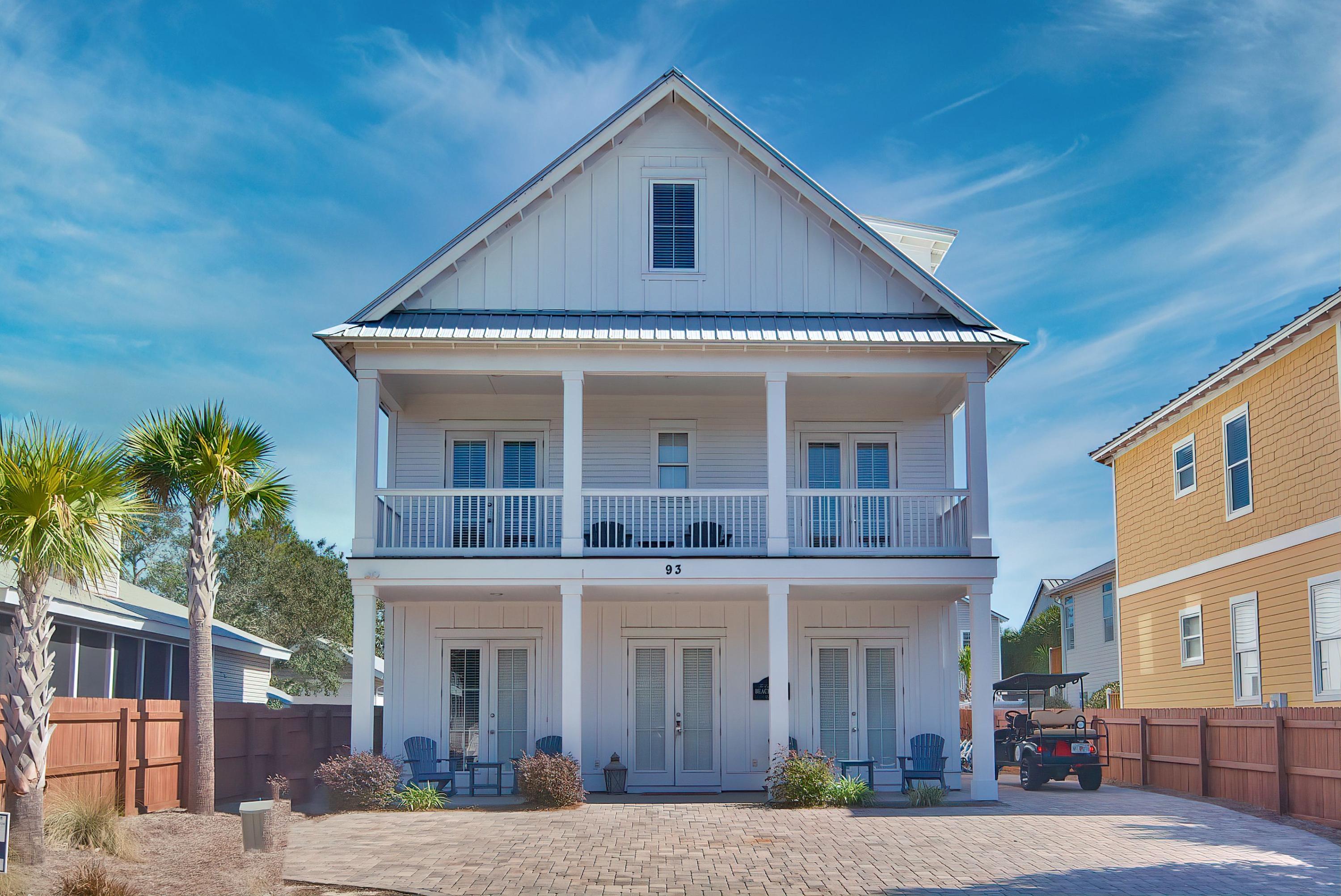 This fully-furnished coastal retreat is ideally located in the sought-after Crystal Beach community and offers several unique finishes and a strong rental history. Bright and spacious, the main living areas of the home feature wood-tile flooring and white wainscot ceilings. An exquisite chef's kitchen provides an inspiring place for preparing meals with its large island, stainless steel appliances, and beautiful blue tile backsplash. Perfect for hosting gatherings with family and friends, the kitchen flows into an inviting dining area with a wine bar. This three-floor residence offers accommodations on each floor and includes six bedrooms and a bunk room. The spacious suites and ample space for parking make this a perfect vacation home or investment property. Outdoor amenities include serene covered porches and a private lagoon-style pool. Enjoy easy access to Gulf of Mexico beaches, just three blocks away.