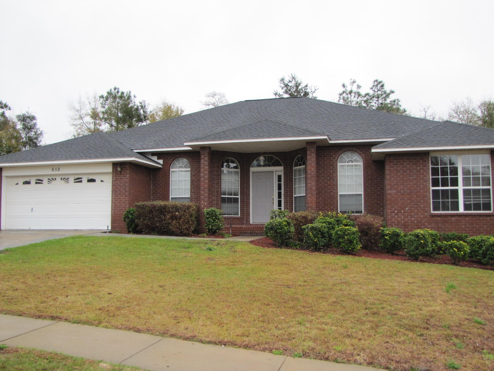 This home features 4 large bedrooms and 3 baths. The floorplan is designed so that the bedrooms are split 3 ways with baths convenient to each. The living room has a high vaulted ceiling, wood laminate flooring and fireplace. The kitchen has a center island, lots of cabinet space for storage and includes the refrigerator. The home has an attached 2 car garage and privacy fenced yard. This home is in a subdivision with covenants and restrictions.Small pet allowed with breed approval but no smoking please.Available August 3.