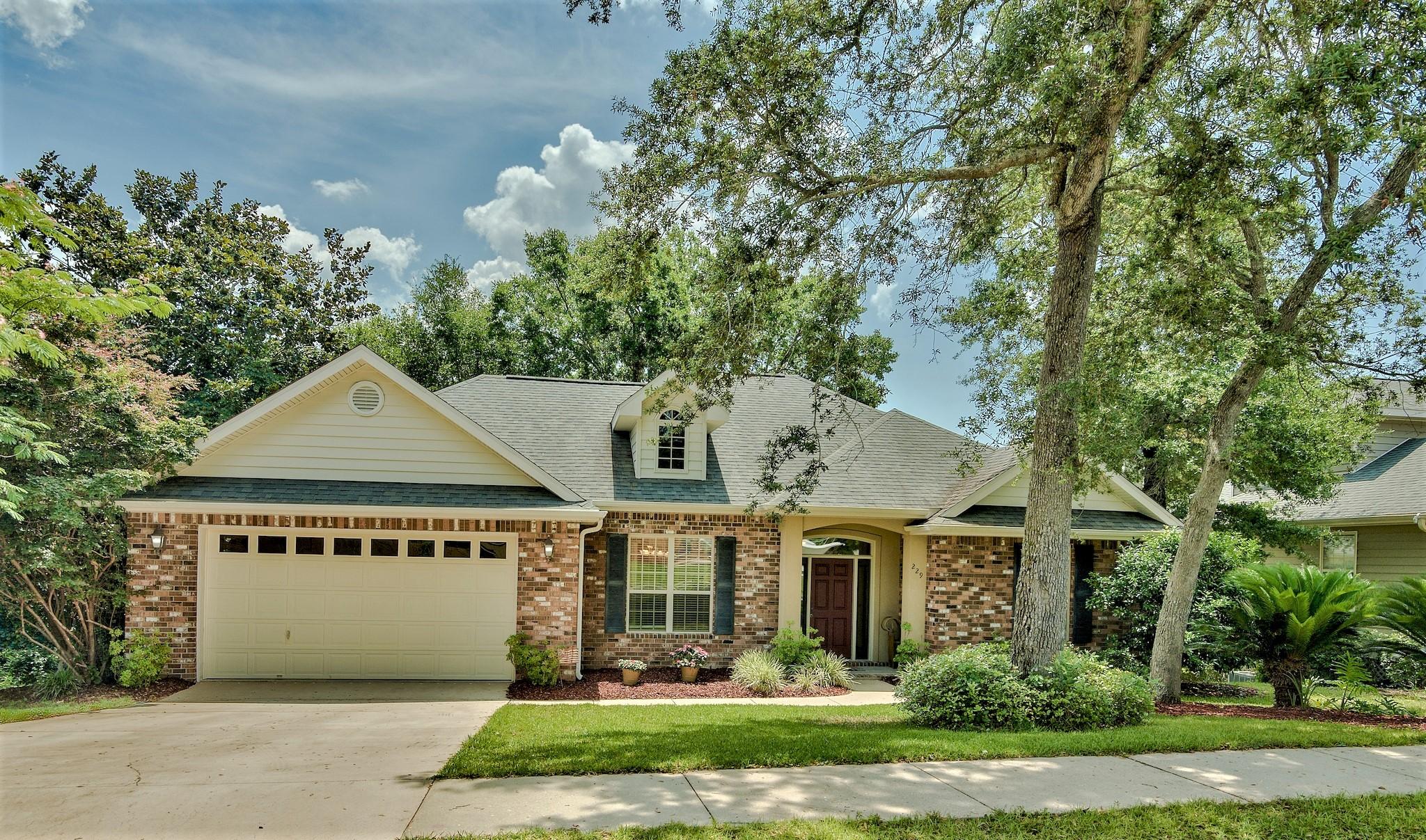 DISCOVER ''THE WOODCREST'' -- a home built by one of Niceville's top-rated builders. This home is perfectly nestled between mature trees, overlooking Beaver Creek. The property offers a small pond & waterfall that would be great as a Koi pond. The multi-level deck and screened-in back porch over-looking the creek provide you with a fabulous BIRD WATCHING & WILDLIFE OBSERVATION point(s). You will feel like you are secluded in the country while living in the heart of Niceville, in very close proximity to shopping centers, restaurants, golf, marinas, EGLIN AFB and Florida's top rated SCHOOLS. A notable feature is the WALK-OUT BASEMENT giving this home a unique ''split'' plan between the master bedroom/ensuite master bathroom on the main floor and the additional 3BDR/2Bath on the lower level The kitchen boasts Silestone countertops, breakfast bar, beautiful cabinetry, a pantry and a large, separate laundry room with additional storage/cabinetry.