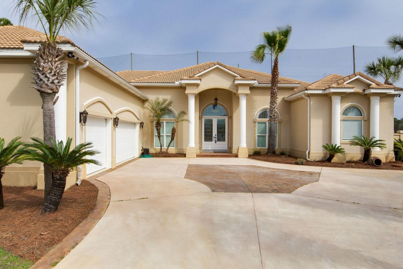 Custom built home overlooking the golf course at Emerald Bay!In a quiet cul-de-sac in the Baywinds neighborhood,this open floor plan is ideal for family and entertaining with formal living, dining rooms, open chef's kitchen/breakfast area and family room all centered around a large lanai and pool with a five foot stucco privacy fence. Own your tropical oasis complete with mature orange trees! This home has four bedrooms, two and a half baths with an additional poolside half bath and a study. The master suite is grand with a fireplace and lanai access. The master bath has two walk-in closets, separate walk-in shower, jetted tub and double vanities.Features include raised ceilings,upgraded appliances, marble floors,custom built-ins,crown molding,surround sound, and triple garag