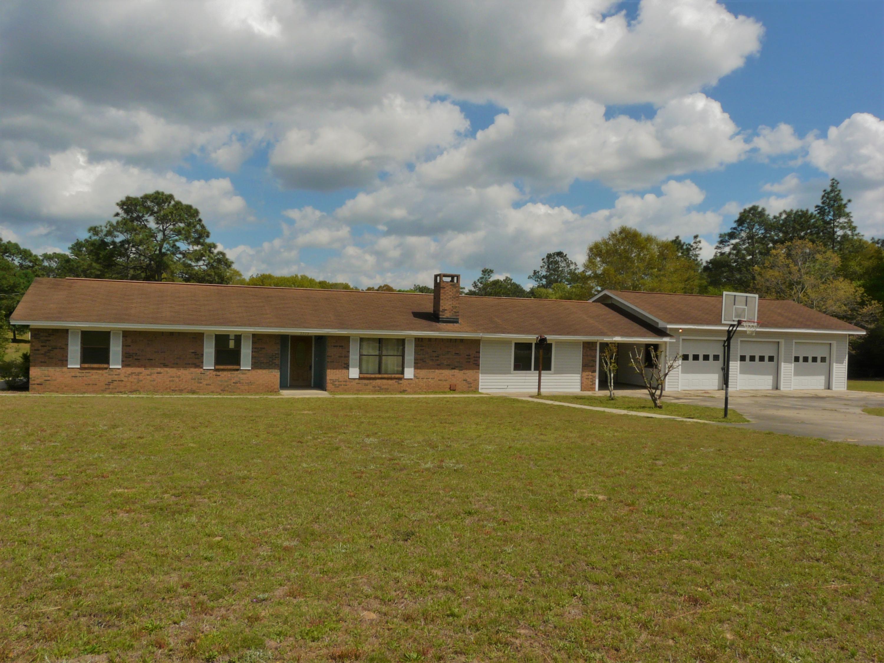 What a deal! Waterfront home on 2 lakes, 3 car garage with workshop, in-ground pool on 2.96 acres! This well built home offers tons of living space inside and out. Home provides 3 living areas and large Eat-In Kitchen. 3 bedrooms and 2 full bath, with option to turn Family Room into 4th bedroom suite. Florida Room off of Kitchen provides amazing back yard views! Enjoy the quiet outdoors while fishing on Lake Alice and Lake Francis (stocked with Bass, Crappie, and Blue Gill)or just enjoy the amazing scenery from the in-ground pool! If you're looking for room to store and work on cars/boats, this is the place! 3 door car garage with workshop! 30 amp RV hook-up on side garage. Seller offering Old Republic 1 year home warranty($425). Enjoy cheaper county taxes! This is truly a unique property! Additional Features:
* 2 working septic tanks on property
* 2 wells, 1 operating (500 ft deep) 
* Cedar closets in Family Room
* Two lakes (that are partially owned) are stocked with bass, crappie and blue gill.
* Lawn pump
* Attic Fan
* Termite Bond just renewed
* Septic tank has been inspected and pumped with clear report. (April 30, 2018)
* Large accessible attic space that goes across all of home, tons of storage space.