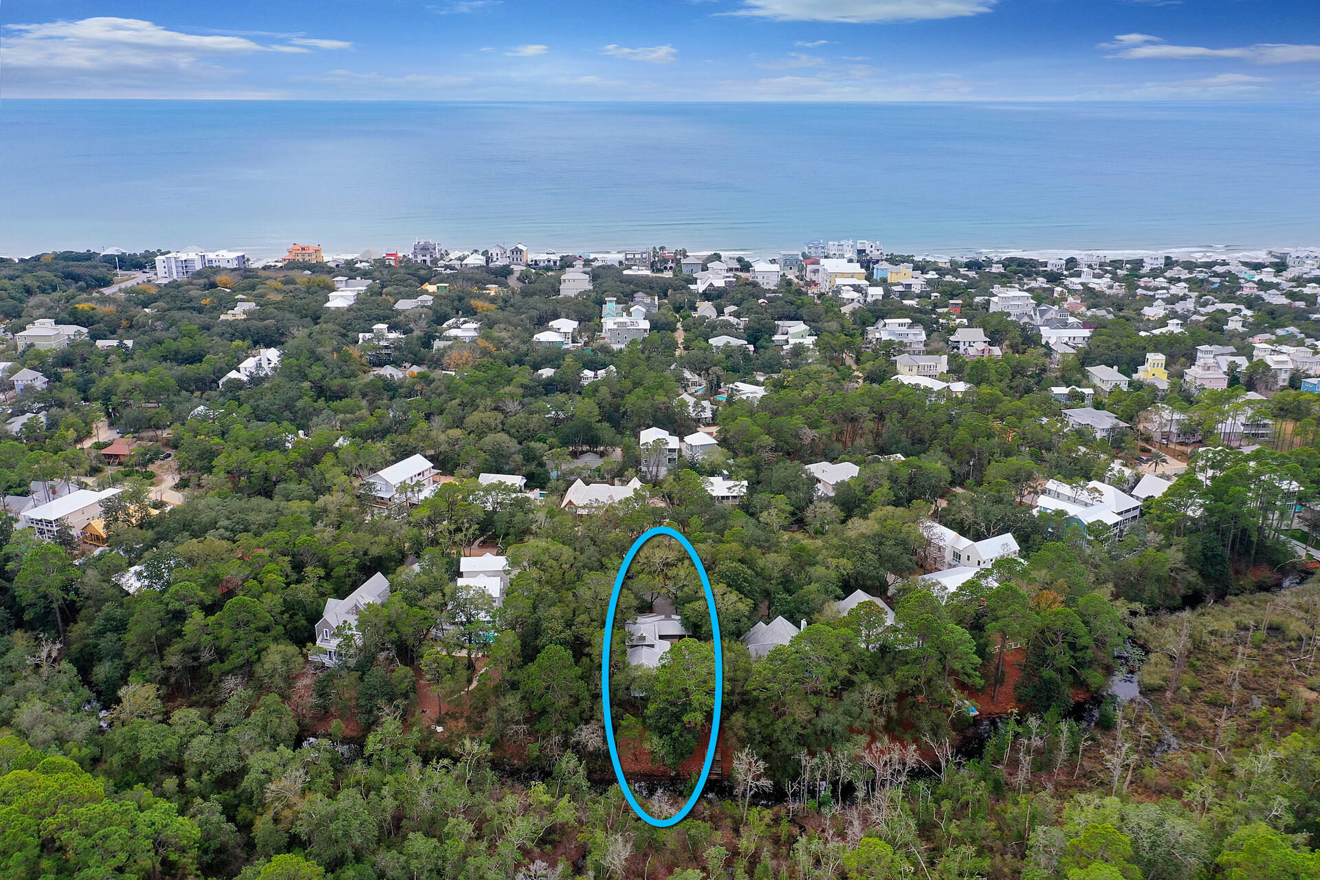 UNDER CONTRACT AND ACCEPTING BACK UP OFFERS. Welcome to Casa sul Canale! This custom-built home sits in a 300+ ft deep, heavily wooded, private setting on Western Lake canal; one of the largest lots on Canal Street. With its Old Seagrove location, it provides easy access to public beaches, Seaside, Watercolor, and 30A. This gorgeous home was carefully designed and built in the Craftsman style architecture with incredible attention to detail and quality craftsmanship.  The main house showcases one-of-a-kind details: 200-year-old heart pine floors, doors and trim from New Orleans' reclaimed cypress, and stained-glass transom windows. Floor-to-ceiling windows flood the interior with light. A fireplace with wrap around mantle and hearth, custom window seats, and a tongue-and-groove vaulted ceiling highlight the living area. The carriage house features a large bedroom, living area, full bath, kitchenette, and private screened porch. An additional 400 sq. ft of heated/cooled space in the lower level is ready to finish as a bedroom, studio apartment, or pool house. Exceptional outdoor spaces are canopied by large oaks, magnolias, and pines.  Wrap around porches, courtyard, and dock emphasize the view of the preserved woods across the canal. This property has so much to offer and is a must-see. Whether you desire a primary residence, second home, or rental investment, you'll find it here. With its large lot size, there are many options for expansion if desired. Fall in love with this architectural masterpiece and the beautifully wooded lot that make this property truly unique!