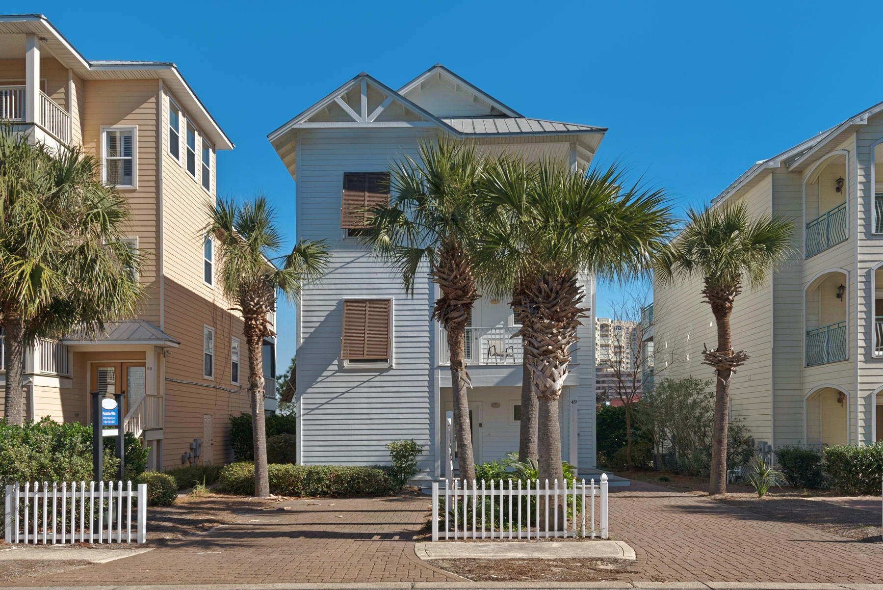 Located just steps away from the beach, ''Paradise Villa'' is a charming lakefront cottage with a private pool! Crescent Beach Cottages is a small community of homes adjacent to the Crescent at Miramar Beach. Featuring new living room furniture, stainless appliances, trayed ceilings, plantation shutters, multiple porches, and access to the amenities of the Crescent Condominiums, this beach cottage is rental ready. Clean as a whistle, the exterior has just been freshly painted. Privacy is apparent with private baths for each bedroom and 2 bedrooms downstairs and two on the third floor, including the spacious master. The open-concept kitchen/ living room/ dining area is spacious and inviting and overlooks a delightful lake from a private balcony. After a day at the beach enjoy the private pool as you grill and enjoy the views of the lake.  This home is currently on a rental program and is convenient to shopping, restaurants, golf courses and boating.