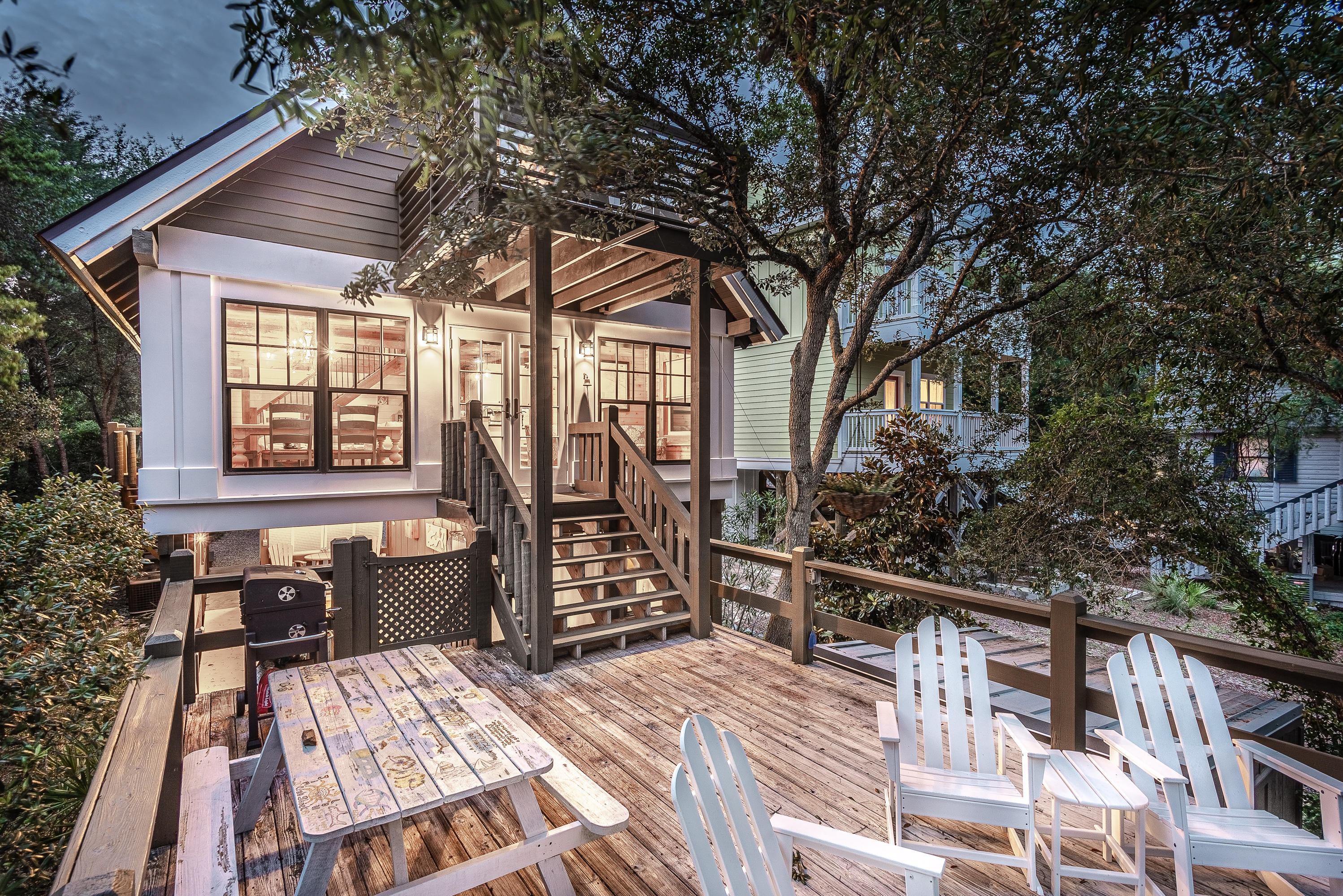 Peaceful waterfront log cabin on Camp Creek Lake with gulf and lake views! This rustic and cozy retreat offers 47 feet of lake frontage on Camp Creek Lake, loaded with multiple decks, a pathway to the private dock and lake access to an uncrowded beach. The front of the home has covered parking for 2 and the driveway gives additional parking. After passing through the covered parking, there is a covered patio which is perfect for entertaining, as well as a guest suite and outdoor shower! The guest suite features a sitting area, twin size bed, mini fridge and a full bathroom. From the ground level, you may choose to walk down to the deck and private dock or you may choose to walk up to the upper deck which leads to the main house. The main living area features an open floor plan with vaulted ceilings, exposed beams, beautiful hardwood flooring, cedar paneled walls French doors leading to an open deck overlooking Camp Creek Lake and boasting gulf views.  The kitchen features granite countertops, a breakfast bar, stainless steel appliances and a gas stove.  The master bedroom is located on the main level with a master bathroom suite.  The second floor contains another full bathroom and 2 additional bedrooms, one of them gracing a private balcony with breathtaking views of the gulf and lake.  Come experience gulf breezes and incredible views while sitting on one of the many decks of this fabulously located home!  Whether you want to fish from the dock or boat over to the gulf, this cozy cabin right off 30-A is waiting for you!