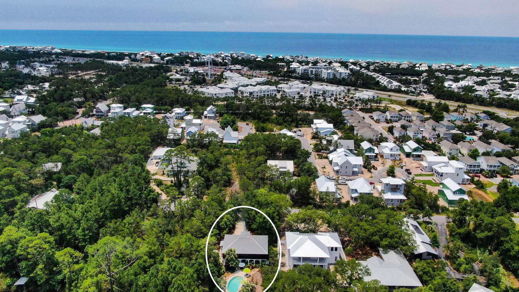 A more peaceful, private location truly can't be found near 30A with this stunning lake-front property located in Inlet Beach on the shores of Lake Powell. Tucked into the pines along the shoreline, the property enjoys its own private dock ideal for endless outdoor activities including fishing, lounging, boating and more. The ground floor of the home features ample living space, the first master suite, a private office, exercise room and sauna, laundry, and the 2-car garage complete with a separate workspace. The second floor boasts a private second master suite with a walk-in closet, 2 additional bedrooms, a custom kitchen, family room, and a balcony with an outdoor shower. Intricate details are found abound with reclaimed doors featured throughout the home, gorgeous hardwoods on the second floor, vaulted ceilings, custom woodwork and a partially screened wrap-around porch with lake. Outside, the private pool and summer kitchen is surrounded by lush palms offering a private oasis. This property offers the best of both worlds. Though private, you are still in the heart of 30A with boutique shopping and dining nearby, the beach access just a quick paddle-board, kayak or boat ride away and its nearby the new pedestrian underpass that provides easy access to multiple public beaches, Rosemary Beach, and all that 30A has to offer.