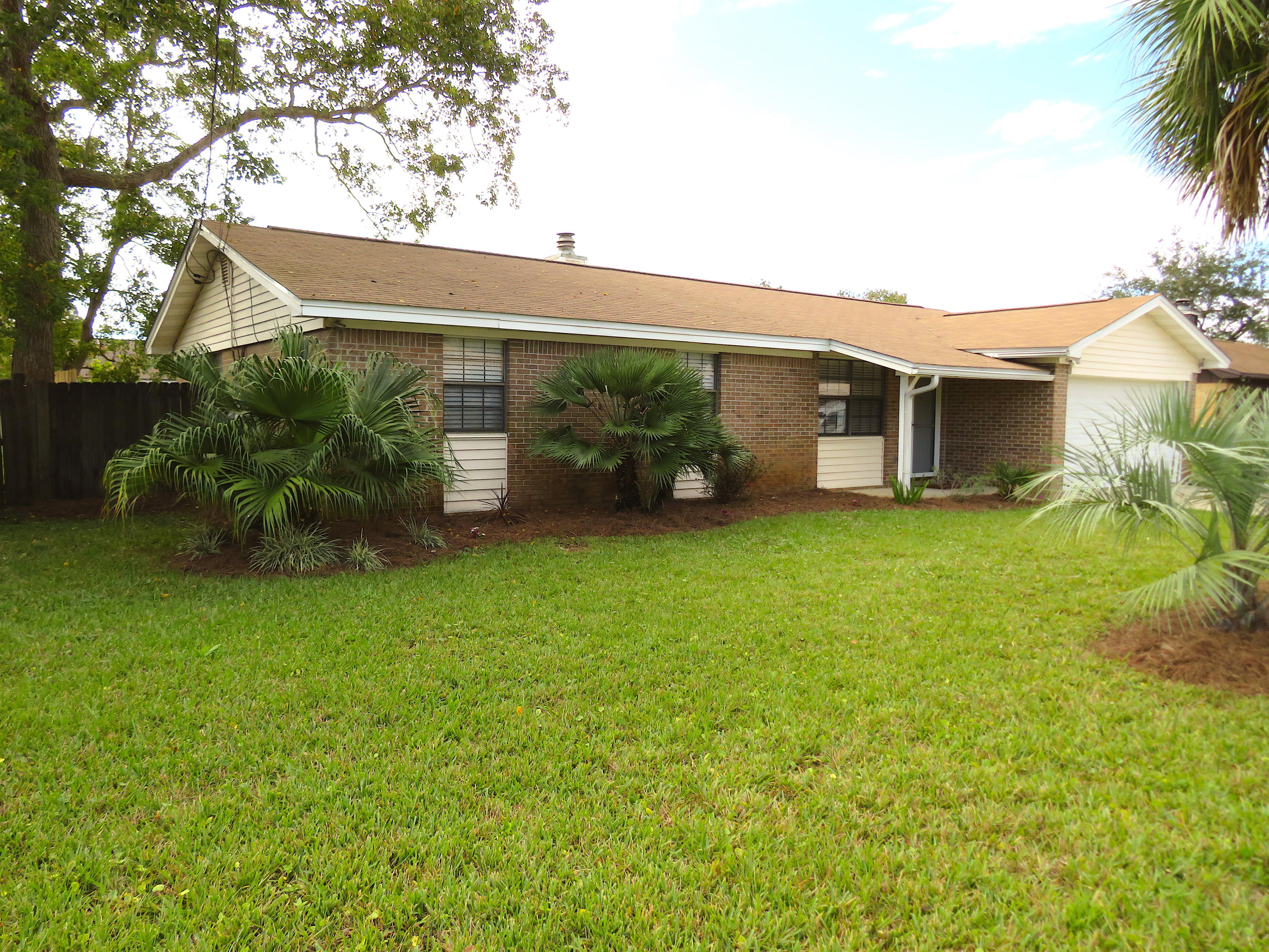 3/2 home with granite countertops, beautiful cabinets. Tile floors in kitchen and both baths and w/w carpets throughout. Wood burning fireplace in large open living/dining area. Side by side refrigerator conveys, new roof in 2018.
