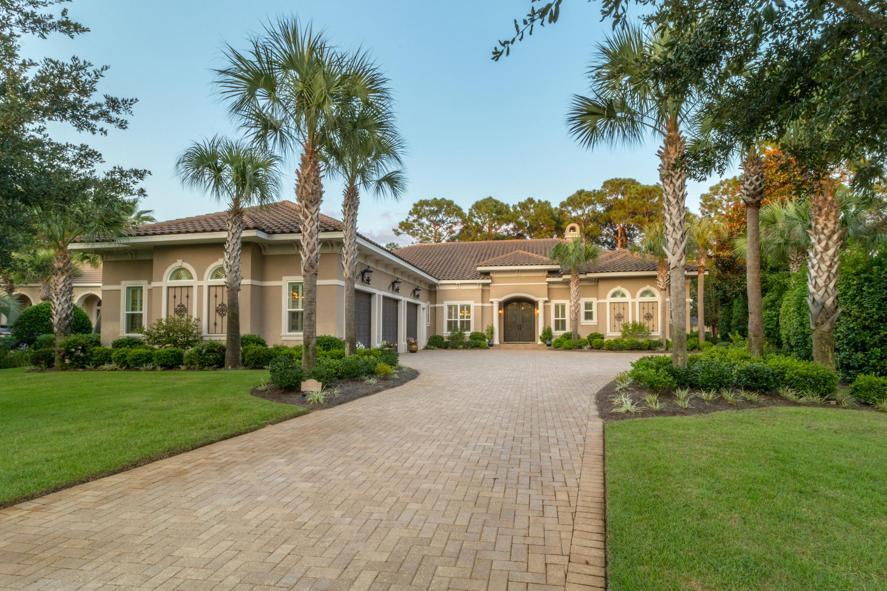 Welcome to your DREAM! A 6,130 sq. ft. custom-built luxury estate located within the prestigious Island Green community. Beauty & elegance exudes from the professionally manicured curb appeal to the luxury interior finishes. As you enter through the double arched wood doors, you are greeted with a front living room with large, 5 pane curved windows showcasing the in-ground salt water pool with spa & waterfall, screened lanai, luxury summer kitchen with fireplace, and the 16th fairway of Raven Golf Course. Entertaining is a delight with the stately Chef's kitchen including a double oven, new gas burner stove (2016), custom cabinets, huge island and breakfast bar. In addition, off the kitchen is a separate wet bar equipped with a wine refrigerator, 2-unit refrigerator and extra storage. Sit back and relax in the 2 living areas on the main floor, each with a gas fireplace & built-in shelving, or in the executive office with hardwood flooring, gas fire place, built-in shelving and luxurious seating.  The master suite features an oversized bedroom with sitting area leading to the screened lanai and a dreamy en-suite with his/her walk in closets, separate vanities, huge walk through shower with separate soaker tub, and the best feature of all...HEATED FLOORING! Family & friends will love the 2nd floor which boasts 2 full bedrooms with private baths, a shared living area with kitchenette and a large covered balcony overlooking the pool & golf course. The details & features are endless! Crown molding throughout, recessed lighting, trey ceilings, plantation shutters, 3 gas furnaces, 4 gas fireplaces, gas water heater, central Vac system, security system, all windows & doors are impact glass, abundant storage areas, huge Laundry with 2nd Full size refrigerator, 3 car garage, new Micro-mesh pool cover (2018), 2 new pool pumps & heater (2017), and so much more! 

As an introduction to the Sandestin lifestyle, we invite our new owners to explore amenities that make Sandestin special. The listing brokerage and seller(s) are presenting the buyer(s) of this property with (2) 90-minute rounds of Tennis court time, a golf foursome at one of our three championship courses, a round of golf for up to four (4) players and an invitation to "Club Night" at the unrivaled Burnt Pine Golf Club.
