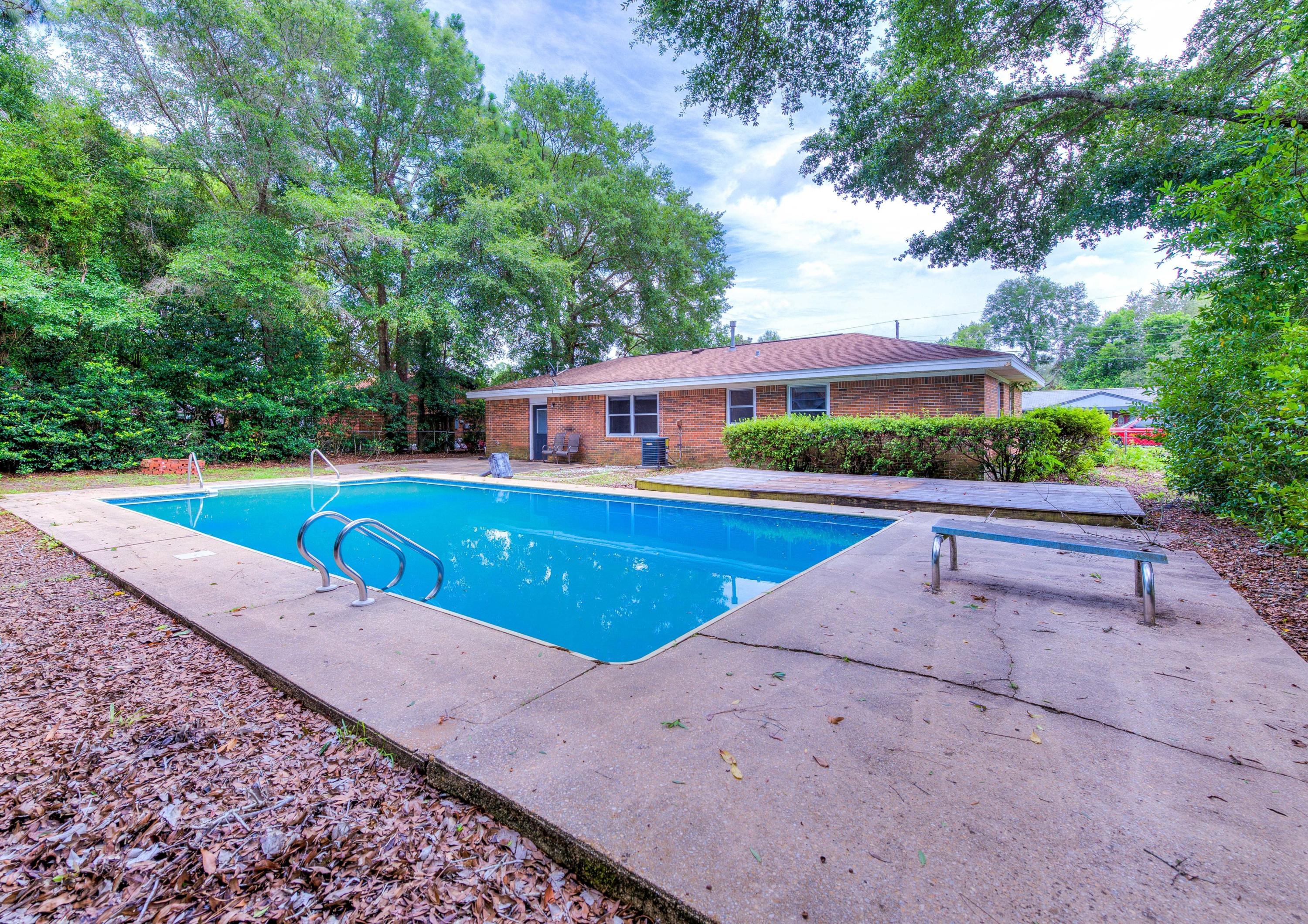 Conveniently located in central Niceville, this 4/1.5 sits on a large lot in a quiet neighborhood.
Upon entering the home you will notice the spacious open floor plan, the dark faux wood floors and a nice neutral wall color throughout.
As you make your way through the home you will see the potential and appreciate how the builder maximized the use of space and square footage throughout the home.
In the backyard you will find a 18X36 pool with a new liner and other new parts, accessories.
Check out the 3D tour.
Schedule your showing Today!