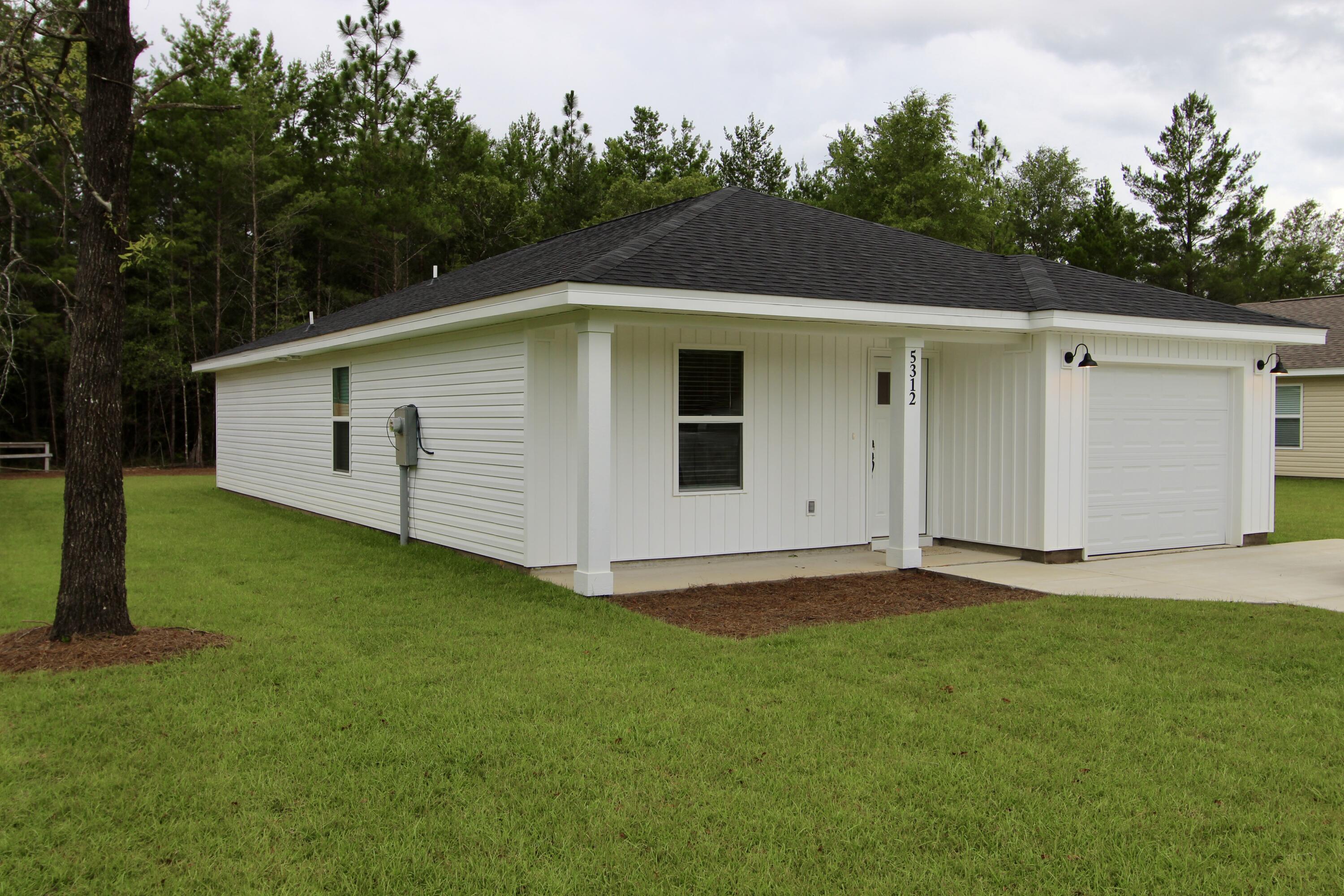 SELLER TO PAY $5,000 TOWARDS BUYERS CLOSING COST AND PRE-PAIDS. SELLER INSTALLED A FENCE
New Construction Completed and ready for an owner and is on a Paved Rd.
The home features LVP throughout the home. The kitchen is open to the living room and features an island, stainless steel appliances, white tile backsplash, granite counter tops and an under mount sink. The spacious master bedroom can hold a king size bed! The master bath has a walk in closet and the bathrooms also have granite counter tops!  Don't delay and you may be able to pick you colors. Pictures are of a previous completed home.