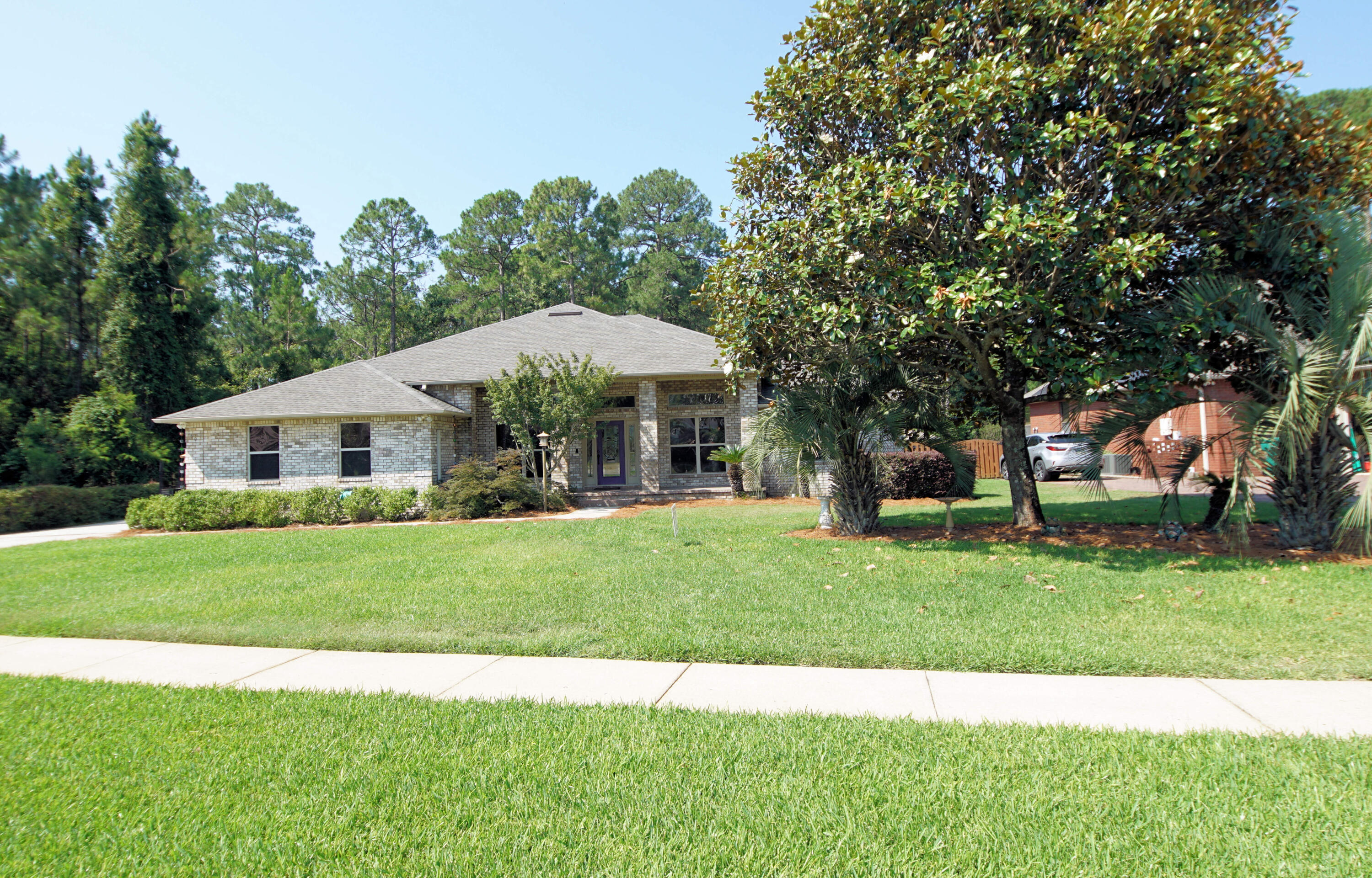 This home is situated in one of the most sought-after subdivisions offering the convenience of an HOA without the expense.  It offers a nice size lot surrounded on 2 sides by a green belt giving you the privacy that you may desire. The front porch says welcome as you pull up perfect for any break of the day reading that perfect book and a cup of your favorite beverage.  As you enter the front door the open floor plan says welcome and can accommodate any furnishes.  The separate dining room and large eat-in kitchen can accommodate any large social or Holiday feast.  There is no wasted space in this floor plan that features 4 bedrooms and 3 baths.  1 Bedroom and bath are adjacent to the back porch making it perfect for the extended stay guest who may need a little privacy. Large Master suite can accommodate any large furniture.  The master bath that can assist in that early morning rush with double sink, separate garden tub and shower.  Large master closet upgraded with closet organizer perfect for organization.
  You are in Florida! It is a must to have your own pool and what is even greater with this home, it is a screened in-ground pool with lanai keeping your pool cooler during the hot summer months. You have the luxury of control of your own home summer swim parties.  There is no detail overlooked with the 3-car garage complete with Gladiator Cabinets and large enough to accommodate any vehicles and storing those extra beach toys, Kayak etc...
Giving you peace of mind, new Roof was installed last week (June 2024).  The seller loves his Solar panels with the small electric bill of $29.99 a month.  Updates included are the HVAC was replaced in 2018, Hot Water in 2021, Solar in 2022, Variable speed pump in pool in 2022, Lanai Screen 2020, Pool deck resurfaced in 2010 or 2012, Film on Windows for heat dissipation in 2007, Kitchen In-Sink-Erator disposal 2021, Kitchen touch faucet 2021, Refrigerator 2022, instant hot water dispenser in kitchen in 2007. 
Is Location Important? This home offers you everything a home could offer to satisfy the convenience of shopping, restaurants and convenient to the 7th Forces, Eglin Air Force Base and within a short drive to emerald, green waters, sugar white beaches, shopping and high-end restaurants in Destin. Near enough to give yourself a vacation every weekend.  
Do not delay!!! Call today!!!