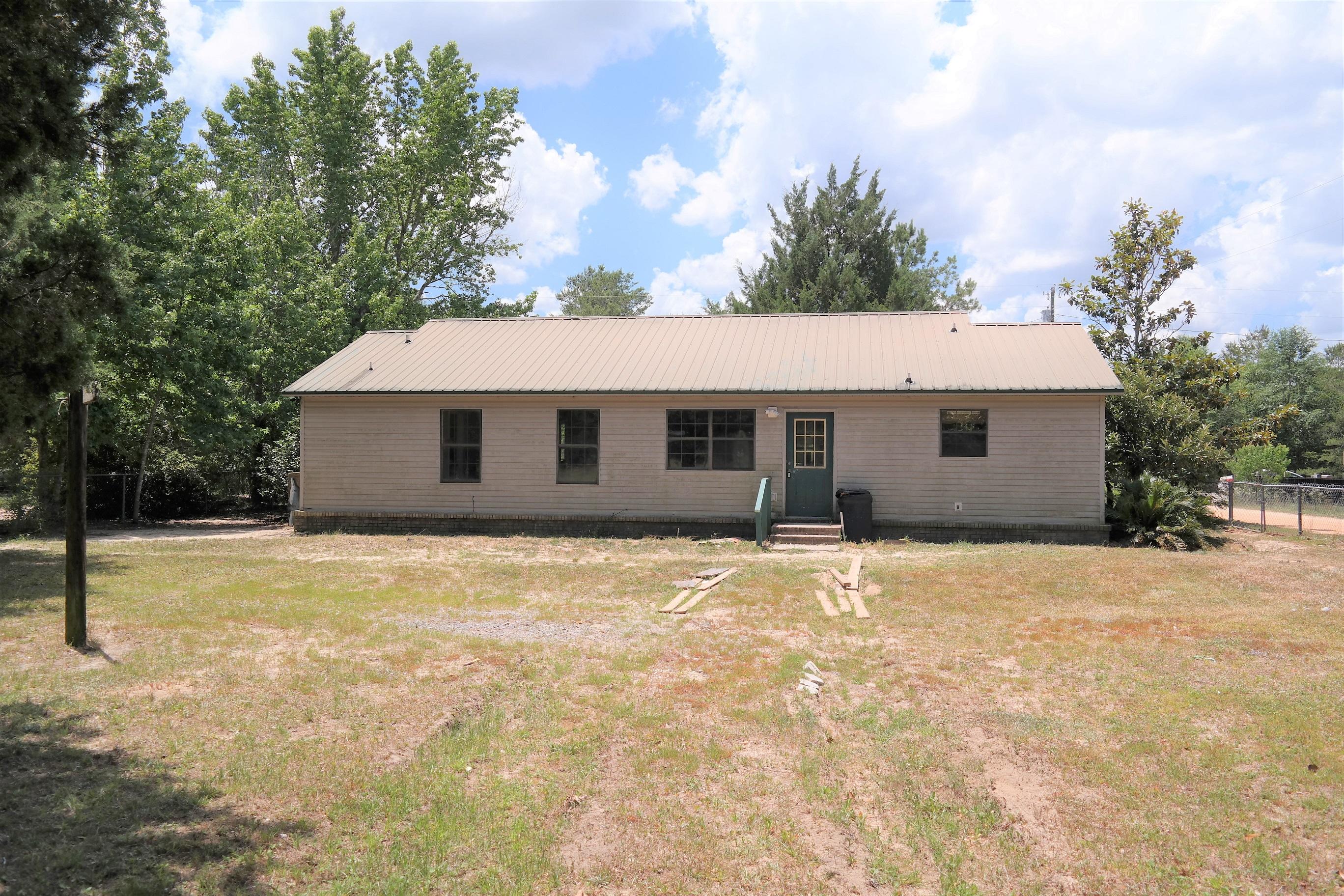 REDUCED FOR QUICK SALLE!! This 3 BR, 2 Bath home on almost 1/2 acre on paved road, with fenced yard, is located in a great location off Rock Hill Rd between Defuniak Springs and Freeport and is apx. 30 minutes from Panama City Beach and the Beaches of S Walton! The home needs a little TLC but is in overall good condition. Master BR has large walk-in closet; Master bath double vanities; generous laundry and pantry. Entire yard is fenced. Schedule your showing today!