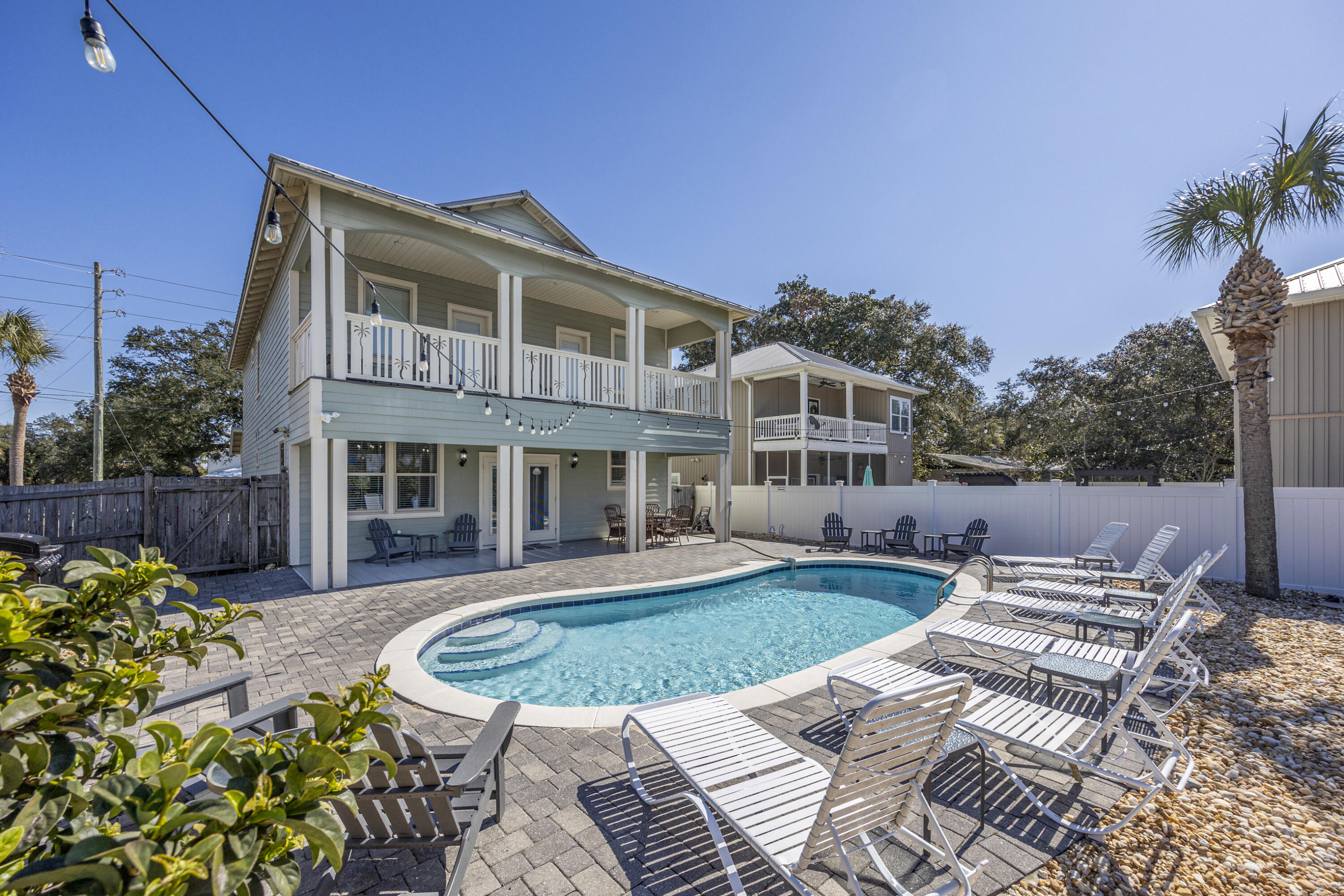 Set at the coveted northeast corner of Crystal Beach, this exceptional residence embodies refined coastal living in one of Destin's most desirable neighborhoods. Thoughtfully designed to accommodate both elegant living & high-performing rental demand, the home offers 7 bedrooms (4 with en-suite baths), 5.5 bathrooms, and approximately 2,800 square feet of well-curated living space, all situated on an oversized lot that presents future opportunity to add a carriage house, further enhancing long-term value & rental potential. The open-concept interior seamlessly connects the kitchen, dining, and living areas, creating an inviting environment for entertaining & relaxed coastal living. Outdoors, a private heated pool & fenced backyard provide a serene setting for year-round enjoyment. The oversized gourmet kitchen features stainless steel appliances, beautiful cabinetry, a generous breakfast bar seating 8, and opens seamlessly to the large living area. The dining table comfortably seats 12, making it ideal for gatherings.

The primary suite is located on the first floor and features a private ensuite bathroom with a separate stand-up shower and large soaking tub. The first floor also offers another bedroom with ensuite bath, laundry, and a half bath convenient for guests. Upstairs encompasses 5 more bedrooms including a king bedroom with a Jack-and-Jill bathroom connecting to a bunk room with two full-over-full bunks, another king bedroom with a private ensuite bathroom and direct access to an expansive balcony that is shared with a bunk room featuring two twin bunk beds.

Enjoy the luxurious backyard retreat, complete with a heated pool and ample space for outdoor games and relaxation. The oversized lot also provides the opportunity to add a carriage house, enhancing future value and rental potential.

Conveniently located in the northeast corner of Crystal Beach, close to dining, shopping, the Gulf, this home checks every box for location, income, and lifestyle.  Also comes with a golf cart.
***Seller offering $10K flooring allowance***