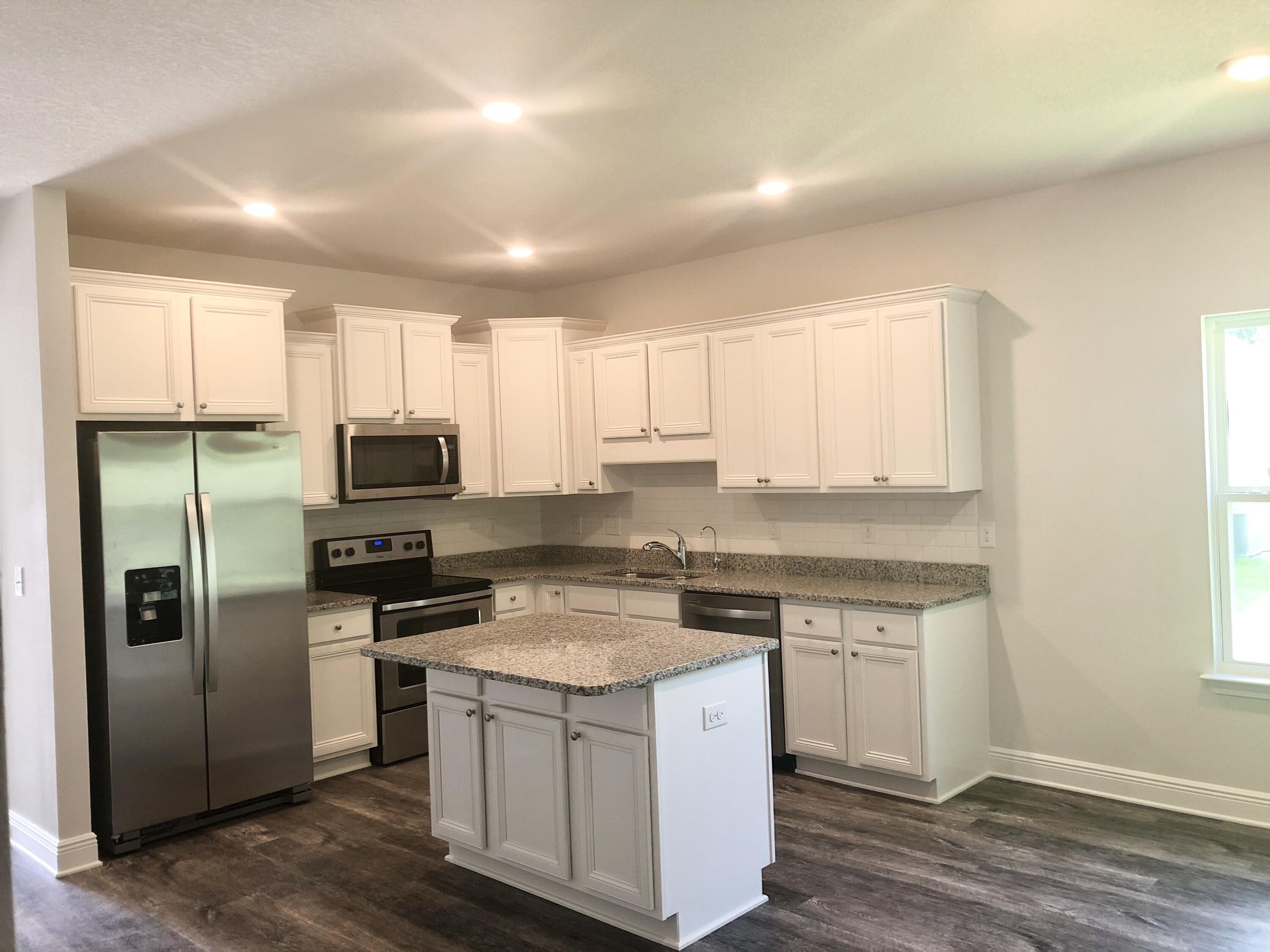 This home has 3 bedrooms 2 bathrooms with flex office/dining room and a 2 car garage. This upgraded smart home features ADT security package, Wi-Fi enabled front door entry, luxury vinyl flooring, carpeted bedrooms, tray ceilings, recessed lighting and stainless steel appliances. The kitchen has bright white subway tile backsplash with granite counter tops. There is a 12x10 covered back porch/outdoor living space for relaxing or entertaining! **Unit has brand new LVP floors and is freshly painted! (Not shown in photos) **Owner pays HOA **Tenant pays for Utilities: electric, water, sewer, cable and internet.** **Washer/dryer not included in home** **Pets are allowed with a $300 non refundable pet fee for first pet and $150 for each additional pet** Square footage is approximate.