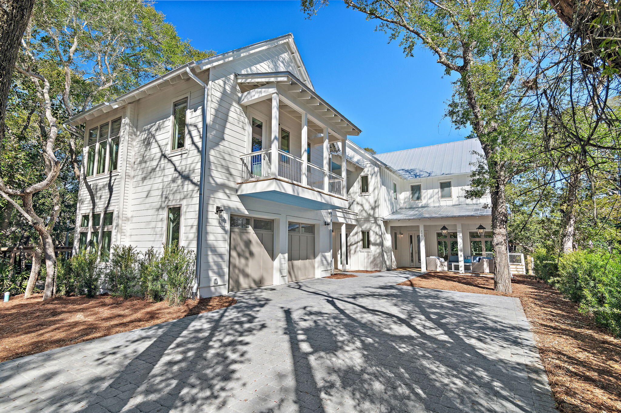 NOTHING SHORT OF SENSATIONAL! This opulent Seagrove Beach custom home embodies the true meaning of relaxed elegance.  Stately, yet embodied with understated elegance, this home boasts 5 bedrooms, 6 baths and  a 1 bedroom, 1 bath carriage home with unequalled detail, style and quality incorporating top of the line finishes including; hardwood and tile flooring, quartz countertops, gourmet kitchen with all stainless appliances, furniture grade cabinetry, raised ceilings, upgraded lighting, with large gas light balconies. The spa-like master bath features a large corner soaking tub and a separate dual head shower with separate his/her vanities. Seagrove Beach is a family friendly community within walking distance of pristine beaches and the upscale shops and restaurants of Seaside.