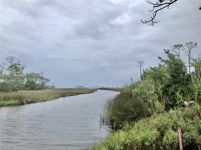 5k in closing cost to buyer. Surrounded by sea!! Located just 2-hours from Tallahassee. Build your custom dream home at the beach on this gorgeous one acre lot within St George Island Plantation. Canal front, have your boat out in the bay in minutes. St. George Plantation is a private, gated community with 24-hr security and located on the west end of St. George Island, Florida. The Community boasts a unique blend of nature, wildlife, sugary sand beaches and the serenity to relax and enjoy a more undisturbed Florida coast. Community amenities include a clubhouse and two swimming pools, three tennis courts, fitness center, walking trails and a FAA authorized 3300' paved air strip. Come enjoy the community conservation areas and catch a beautiful sunset.