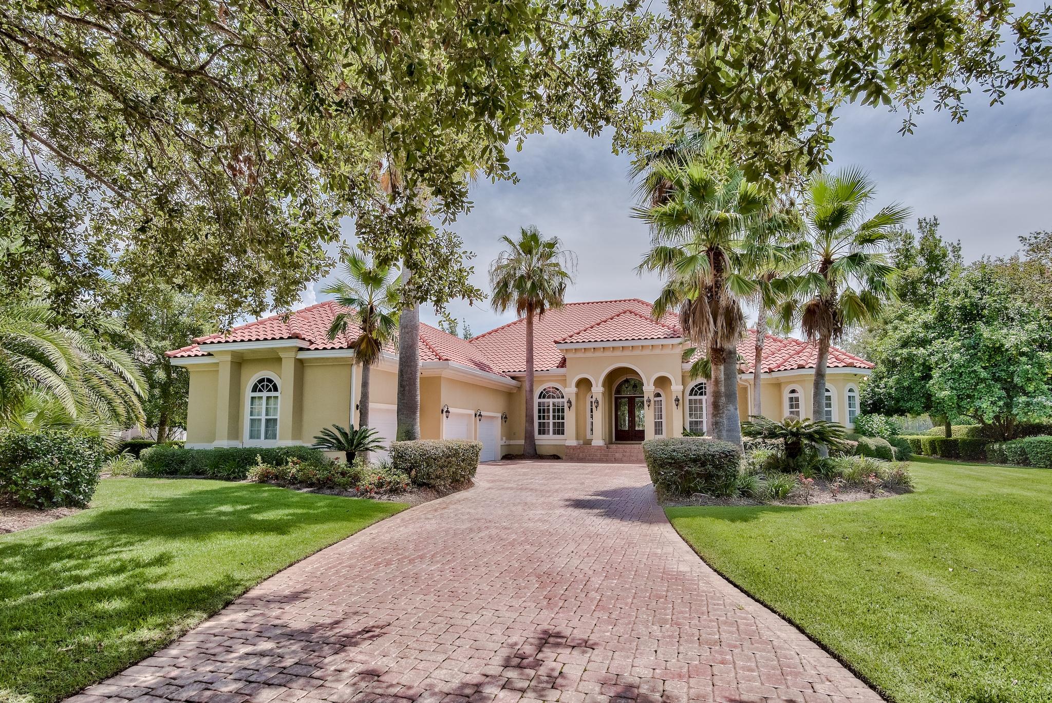 Inside the gates of Destin's premier community of Kelly Plantation lies this custom-built home by renowned Boswell Builders. This single level, 4 bedroom home with separate office sits on an oversized lakefront lot overlooking multiple fairways. Once inside the home you will be greeted by raised ceilings, a gas fireplace and two separate living & entertaining areas. The kitchen boasts custom cabinetry along with granite countertops and a large island. The master was thoughtfully positioned along its own wing and features ample natural lighting, dual closets, ensuite bathroom with dual vanities, soaking tub and walk-in shower highlighted by tile surround. Kelly plantation is a gated community located in the heart of Destin, Florida and features premier access to incredible community  amenities such as the golf club, equestrian facilities, clubhouse with community pool & fitness center, tennis courts and a multitude of green space, walking trails, lakes, playgrounds and outdoor activities.