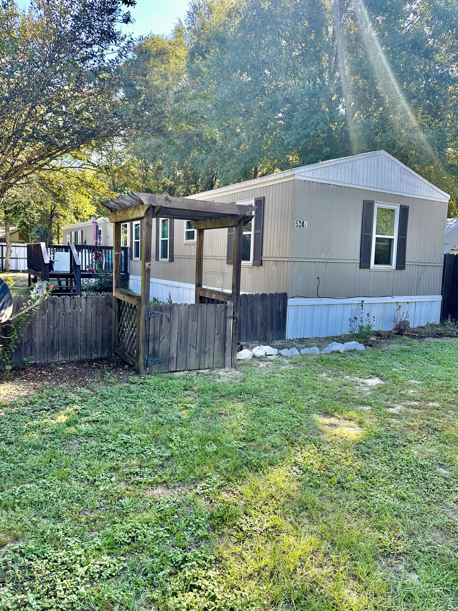 SUPER  PRICE REDUCTION!  BRING YOUR BUYERS! GREAT RENTAL PROPERTY OR FIRST HOME!!
Welcome home to this beautiful 3 bedroom 2 bath mobile home.  This home is in excellent condition.  All windows have been updated last year.  Roof has been recoated in the last 30 days.  Hot water heater was updated 2 years ago.
LVP flooring was updated several years ago.  In the backyard is a 10x12  metal building for plenty of storage.  This home is move in ready.  This home would be an awesome investment property or for a first home buyer. 
There is a large deck on the front of the home for entertaining. This home is in a great location minute from Hwy 90 east and minutes from shopping and entertainment. Buyer to verify all areas of importance, including but not limited to room size, zoning, lot size