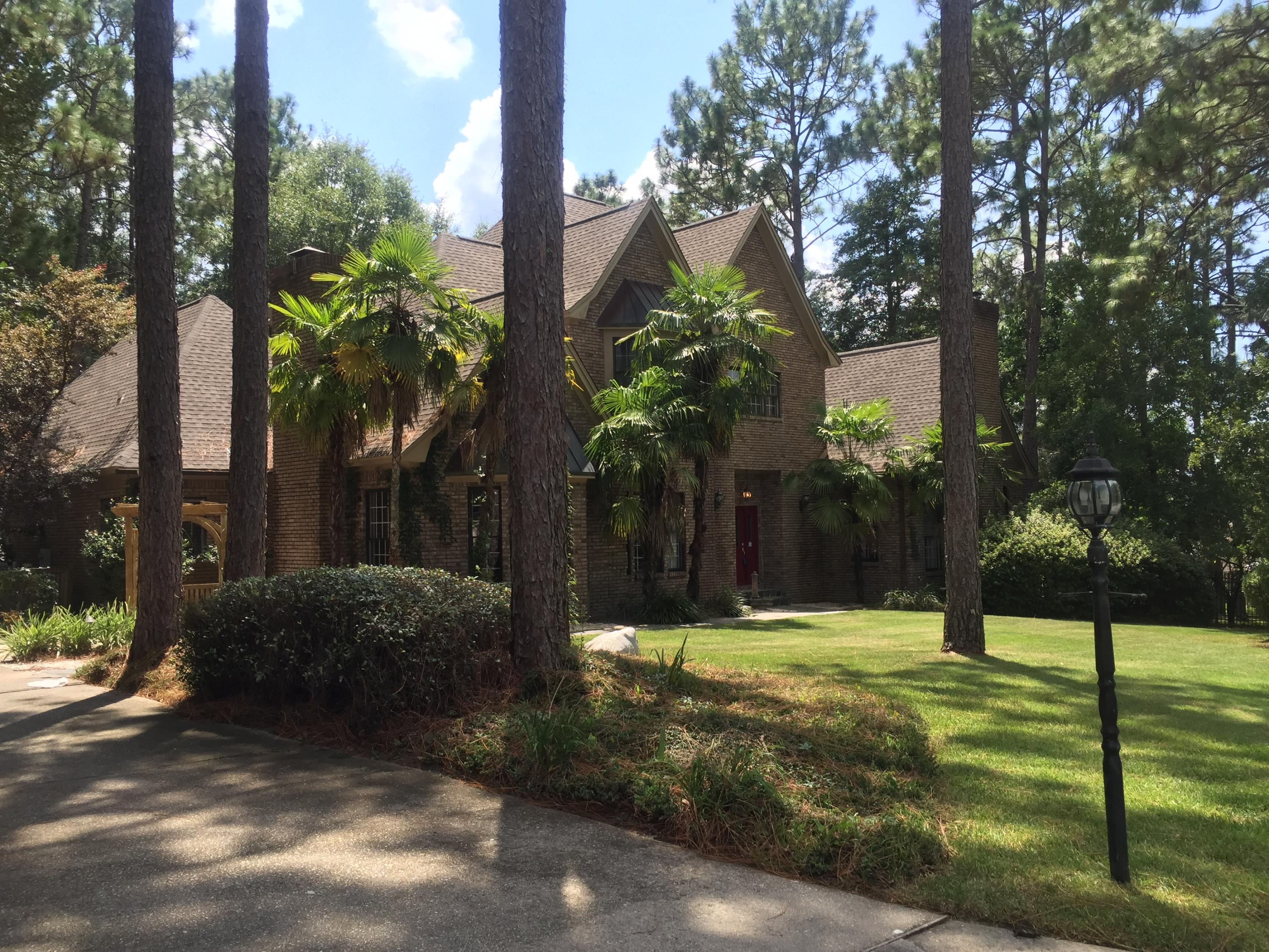 Stunning Estate property with screen enclosed pool located SOUTH of I10 in a picturesque setting reminiscent of the classical English countryside homes in Europe! BRAND NEW ROOF so you can benefit from reduced insurance costs as well as low county taxes! You will feel like you are surrounded by your own private park in this custom built home with 4 bedrooms and 3.5 baths, Large entry foyer with grand central staircase, hardwood floors, double coat closets, and SO MUCH SPACE! To the left of the entry is a large formal dining room with tray ceiling and a large bay window, to the Right is a massive formal living room that is encased with large windows and features a gas fireplace with marble surround! behind the formal living room is another family room with built ins and a wall of windows overlooking the pool! Just off the family room is a large office space with build in desk and counter space, perfect for use as office, hobby area, kids work space, or craft area. The kitchen and breakfast area overlook the pool! The kitchen has been updated with new stainless steel appliances, travertine floors, natural slate and granite counter tops! The downstairs master bedroom is grand and elegant. The space features its own gas fireplace, huge window seat, hardwood floors, and a spacious master bathroom with corner whirlpool tub, double vanities (one with sit down makeup area), stained glass windows over the tub, and 2 walk in closets. At the top of the grand curved staircase is a large library loft area with floor to ceiling built in bookcases and a workspace looking out of the massive window. Upstairs there are 3 large bedrooms, 1 with its own private bathroom with marble floor, and an attached Ballet room complete with wood floor,mirror , and ballet bar! The other 2 upstairs bedrooms feature large walk in closets and a Jack and Jill bathroom with double sinks. Throughout the home you will notice the details such as crown molding, chair rail, plantation shutters, custom built ins, brand new carpet, and spacious and functional floor plan. Step outside and you will be wowed by the HUGE enclosed pool area with sparkling pool, hot tub, built in grill, and an oversized pool deck area that is perfect for entertaining or just relaxing. The pool feels very private as this home sits on 3 premier estate lots! The aluminum fencing, gazebo, outdoor swings, and the beautiful trees add to the park like estate setting. There is even a basketball goal to round out this family friendly home! If you are looking for a large custom home close to EVERYTHING for 1/2 the price of Niceville and 1/3 the price of Destin, call to schedule your private showing today! This property has been newly painted and updated and is ready for you to add your own custom touches to create the home of your dreams. Crestview's southern most location, 10 minutes to Duke Field and 7th SFG, 20 minutes to Eglin AFB, 30 minutes to the beautiful beaches of the Emerald Coast, and only 5 minutes to North Okaloosa Medical Center.