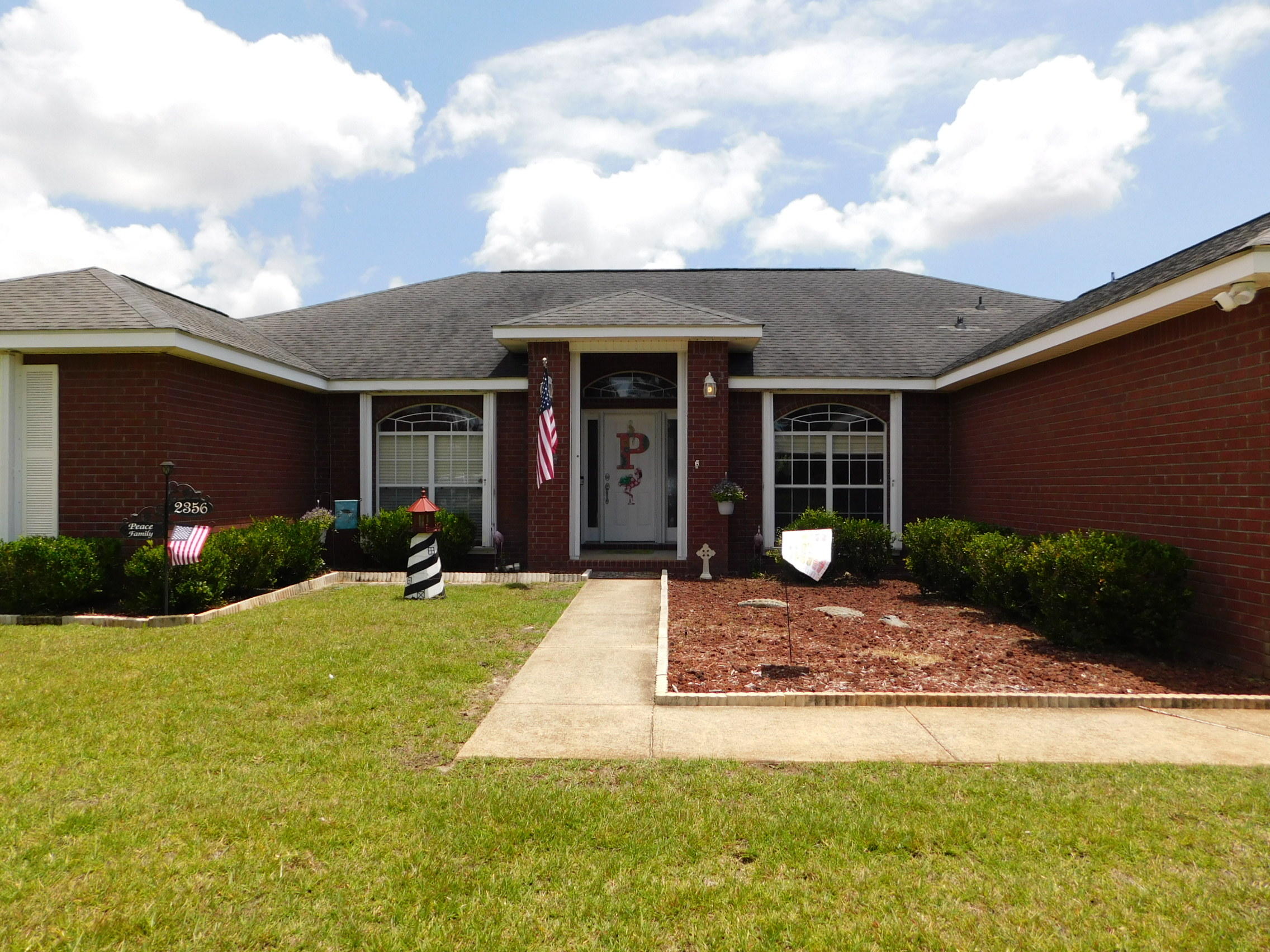 4BR/2BA ALL BRICK home on a huge .73 acre, corner lot in Holley By the Sea! Over 2,800sf of living space! New Carpet! 4 Bedrooms PLUS Dining Room and Office! Home has been deep cleaned! 30 Year Dimensional Roof in August 2005 and is in Great Condition. All Plumbing boots were recently replaced. 22 X 14 Screened Porch expands the already generous living area. Back Yard is Privacy fenced and there is a Bonus CUSTOM BUILT Workshop with Power! METAL Hurricane Shutters help reduce insurance costs and make preparing for a storm very easy. The Kitchen is Amazing with beautiful white cabinets, Large Island, Walk-In Pantry, BRAND NEW Double ovens, Quality Bosch Dishwasher, Microwave & Glass top range. Breakfast Bar/Island is great for Entertaining! Spacious Family Room with vaulted ceilings & corner wood burning fireplace.  Formal dining room and large separate breakfast area Beautiful master suite with ''his'' & ''her'' walk-in closets, dual vanities, oversized jetted garden tub and large separate shower. In addition to 4 Bedrooms there is a Formal Dining room + An Office!  Additional amenities include: Tile flooring (entry, kitchen, breakfast area, hallway, master bath, guest bath and laundry room), crown molding (formal dining room, master suite, private study & guest bedroom), side entry 2-Car Garage and New (2019) hot water heater!  Large Laundry Room is located inside.   All the benefits of the HBTS Recreation Center are included! Pools - Tennis - Boat Launch and More!  Call to see this Wonderful Home Today!