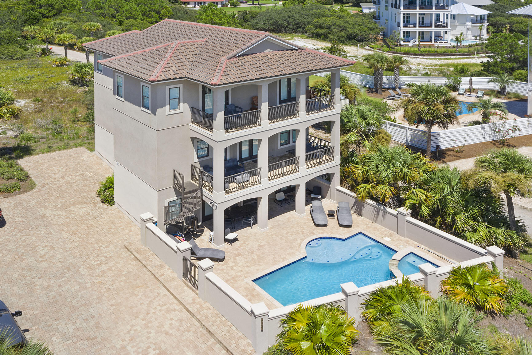 Gulf Views in Front + Coastal Dune Lake in Back = Pure 30A Perfection. 

As if this perfectly positioned 30A mediterranean beach home is not enough, this lot is so large you can add another home, pool, and mini golf course. Plans in hand and will convey!

Forever uninterrupted Gulf views with county owned facilities across the street, and the serene beauty of a coastal dune lake in the backyard, this 6-bedroom, 6.5-bathroom masterpiece offers a one-of-a-kind blend of natural luxury and architectural elegance. 

With over $120K already booked for 2025, this home is both an exceptional income generator and a peaceful personal retreat with a huge value add opportunity! Other property features include: 
* Spacious covered balconies on each level
* A backyard oasis with views of a coastal dune lake, a natural phenomenon unique to this stretch of Florida's coast.
* Private pool, hot tub, and waterfalls designed for total relaxation.
* A short walk to Stinky's Fish Camp and other local favorites
The residence itself stuns with:
* Nearly 3,500 sq ft of living space across three stories
* Custom 10'-11' ceilings, sleek tile flooring, and recessed lighting throughout
* A private elevator for effortless access to every level.
Gourmet kitchen featuring granite countertops, custom cabinetry, and premium gas Dacor appliances.
* No HOA dues and incredible flexibility for primary living, a second home, or a turnkey investment.

This is 30A living at its finest  where coastal elegance meets unbeatable location, and nature's beauty surrounds you at every turn. The rarest of gems with views in both directions AND space for an addition. Don't let this opportunity slip away!