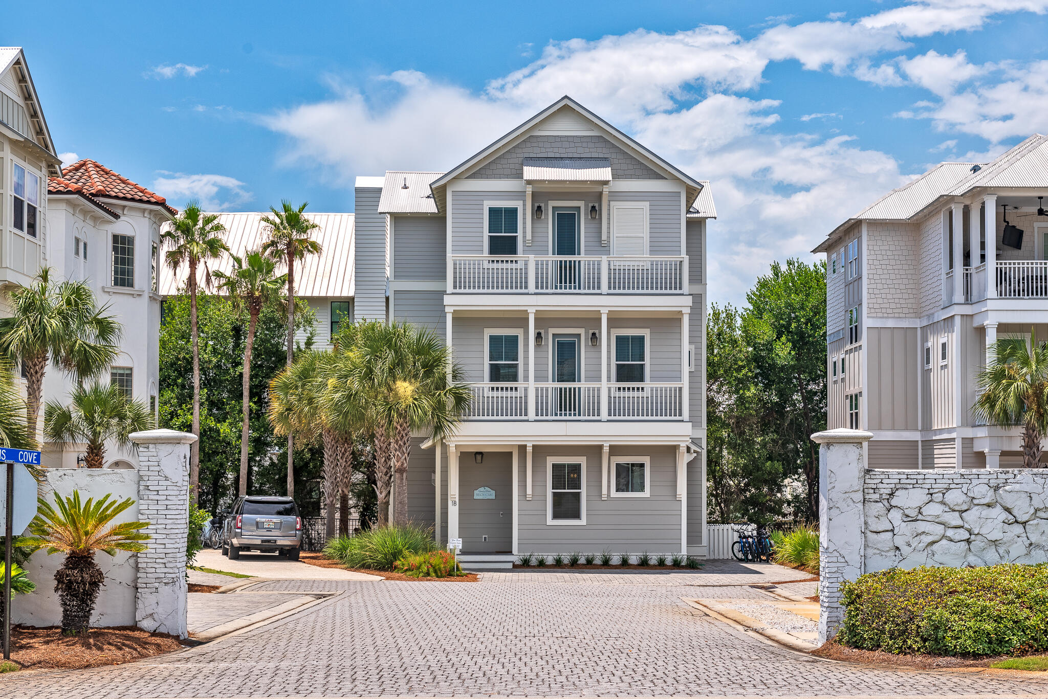 Located just east of Rosemary Beach and a short walk from the soft white sand, this fully furnished beach house was designed for outdoor living. Three floors of contemporary living space spill out onto 695 square feet of outdoor balconies on both the front and rear of the home. They provide an abundance. of outdoor space for gathering together over a barbecue or enjoying your own privacy and peace. This stylishly designed BetterBuilt home features high-quality construction including hardwood flooring, impact/hurricane-resistant windows and a durable metal roof. The open living room on the first floor is beautifully presented with wood-tile flooring, shiplap walls, muted decor and a cozy fireplace. The formal dining area is tucked away in its own semi-separate nook for entertaining. (more) Enjoy your favorite playlist on the Sonos sound system while you relax together. Food lovers will appreciate the gourmet kitchen, which boasts a range of gleaming white cabinets, Fisher & Paykel appliances and quartz countertops. Hop onto a bar stool and chat together at the central island, which houses under-counter appliances and a farmhouse sink. Bedrooms are spread over all levels with the magnificent master suite on the second floor. Kids will have fun making memories in the second-floor bunk room while the third-floor bonus room is a spacious media/game room complete with a wet bar and fridge. The adjoining balcony is the perfect space for watching the sunset and sharing the day's adventures. Available fully furnished and rental ready, this beach house is in a league of its own. To the front of the beach house, there's paved parking for three vehicles and views of the community pool nearby. The home is located within 13 acres of undisturbed dunes making it a nature lover's dream. The beautiful white sandy beach is just down the street and just offshore an artificial reef encourages marine life to flourish. Nearby Camp Helen State Park is a haven for kayaking and paddleboarding on Lake Powell while 30Avenue offers a choice of shops and eateries.
