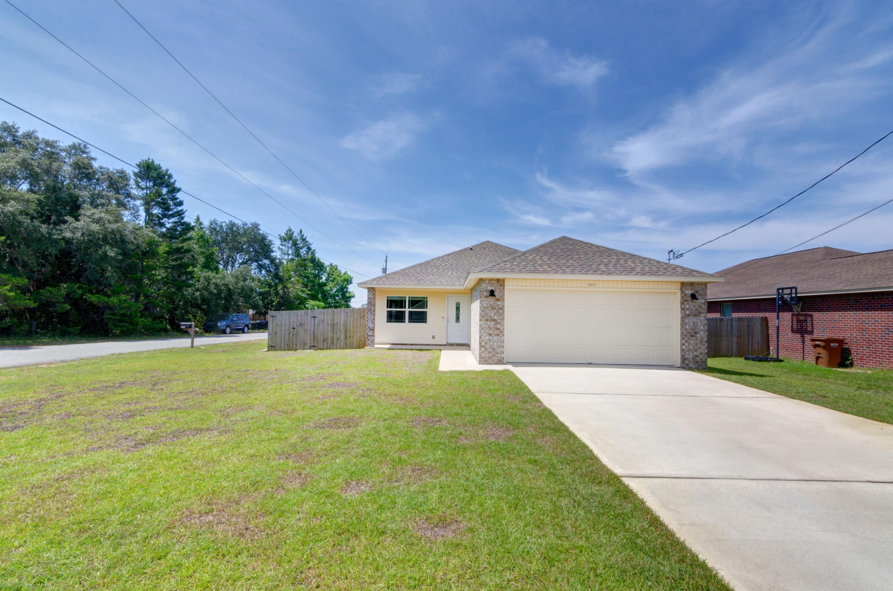 Located in a corner lot in east Navarre with no HOA! Welcome home to this move in ready 3 bedroom/2 bath home that's only 3 years old! Say goodbye to high power bills, this home comes with solar panels where you'll enjoy a total monthly payment of only $100 instead! Inside you'll find great upgraded features like hard surface flooring throughout (no carpet at all!). Just inside you'll enter to find a great living room complete with a large trey ceiling, and the open floor plan leads to the eat in kitchen space and then the well appointed kitchen. Featuring granite countertops, stainless steel appliances, and a separate pantry. The split floor plan positions the master bedroom off of the kitchen, and you'll love the massive space! The bedroom features a walk in closet, and the bathroom has double vanities. The other two bedrooms are located on the other side of the house and have ample closet space with a shared bathroom. The interior laundry room is huge with plenty or room for additional storage and it leads to the two car garage. Outside you'll find the fully irrigated yard with a fully fenced in backyard. Welcome home!