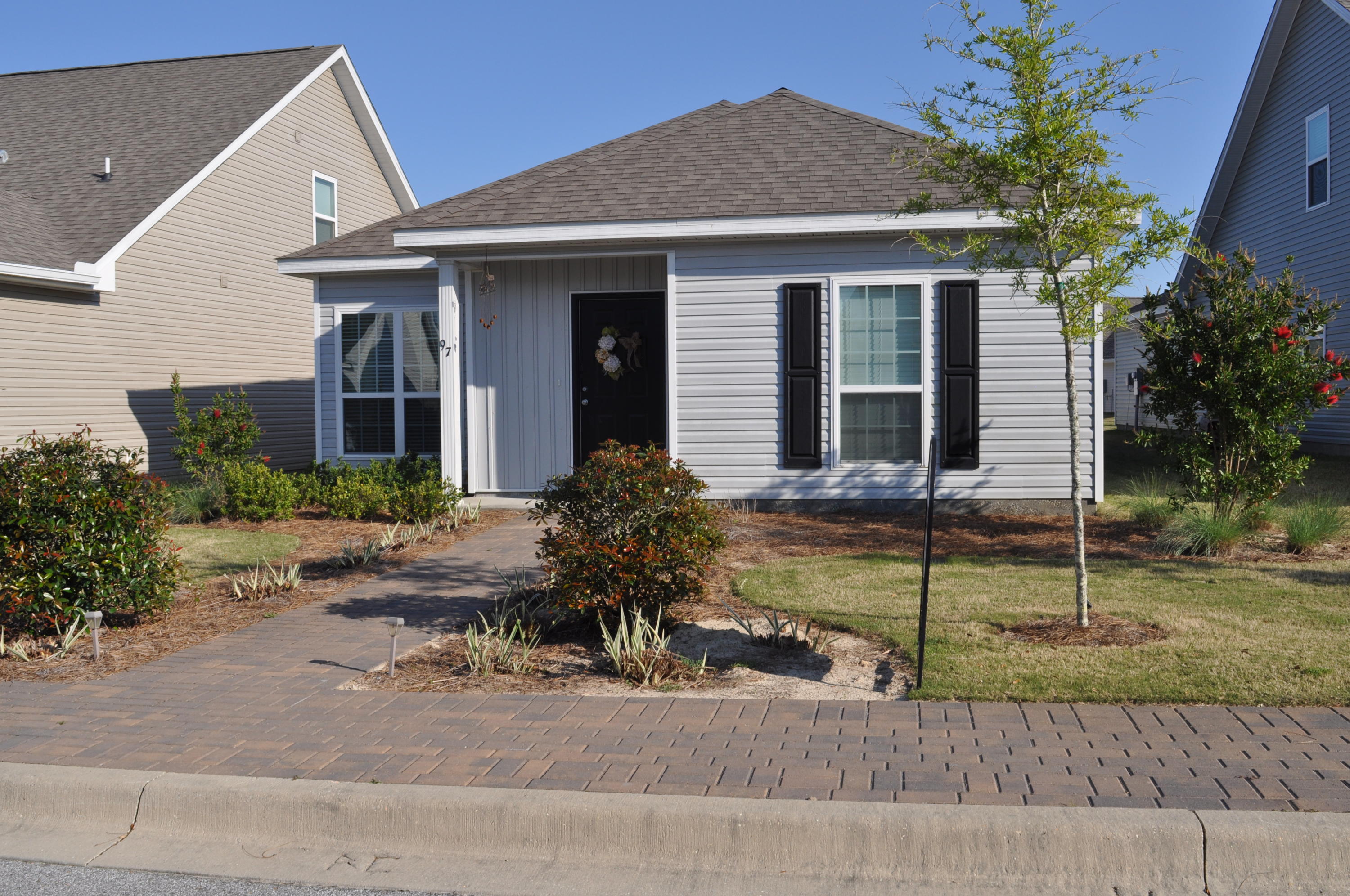 Located in the Schooner Landing neighborhood, this home is walking distance to the Hammock Bay amenities center. Interior space includes three bedrooms, two bathrooms, open living area with beautiful wood laminate flooring and open kitchen with laminate countertops. The exterior is reminiscent of the Southern craftsman style with large porch on the front and paver patio on rear of home. A two car garage provides security and extra storage. HOA, Garbage, Basic Cable and lawn maintenance included. This home is within walking distance to the wonderful amenities at Hammock Bay. Hammock Bay is a pedestrian-friendly development.  There are network of sidewalks, nature trails, and bike paths.  The Hammock Bay Town Square-lawn-style amphitheater is designed for entertainment. There is also a $12+ million, 60-acre Sports Park featuring a multitude of ball field/park amenities nearby.  Recently the developer donated land for two schools to be built in Hammock Bay.

The Lake Club at Hammock Bay includes a 25 meter lap pool and a resort-style pool, lighted tennis courts, putting green, $250,000 playground, lighted basketball courts, meeting/functions facility, caterer's kitchen, and 6000 sq. ft. clubhouse with movie theatre.  Adjacent to the Lake Club is the Fitness Club at Hammock Bay, a 4000 sq. ft. state-of-the-art fitness facility featuring Body Master Weight equipment and Life Fitness cardiovascular equipment w/flat screen TV's.  There is also the Bay Pavilion at Hammock Bay, located on 480 ft. of shoreline alongside the Choctawhatchee Bay.  

Hammock Bay offers a pet park entitled Canine Commons at Hammock Bay. This pet park provides an outdoor doggy-washing station and drinking-bubblers.  Hammock Bay is currently one of 600+ communities in the United States that features the most advanced fiber optics technology direct to homes through Centurylink's FTTP (Fiber To The Premise) program, providing capacity for the latest advances in phone, internet, and cable technology.  Hammock Bay is located in a Community District Development to ensure the highest quality of infrastructure for years to come. We invite you to come take a tour of this exceptional home and experience first-hand the Hammock Bay "way of life!"
