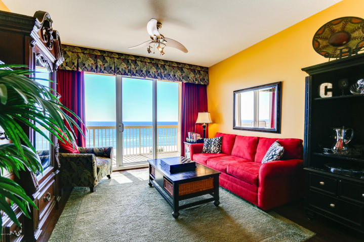 Raising the standard of beach living, this desirable low floor, one bedroom unit has a Master Suite and Great room located directly on the Gulf of Mexico. Both have access to the oversized balcony which is why this floor plan has the best potential for rental income. Enjoy spectacular ocean and pool views from the living area, kitchen and master suite! This property features nine-foot ceilings, hard surface flooring throughout, recessed lighting, & granite counters in the bathrooms and kitchen. The Caribbean styled Calypso Resort features amenities that include: 2 heated pools overlooking the Gulf, beach side Tiki Bar, impressive fitness area, community center, seasonal beach service, on-site rental desk, high speed internet service, not to mention the BEST location on the beach
